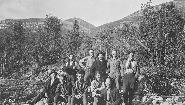 group photo of the Alberta-British Columbia Survey crew, including an axeman,
monumental builder, cook, chainman and a first and second packer.