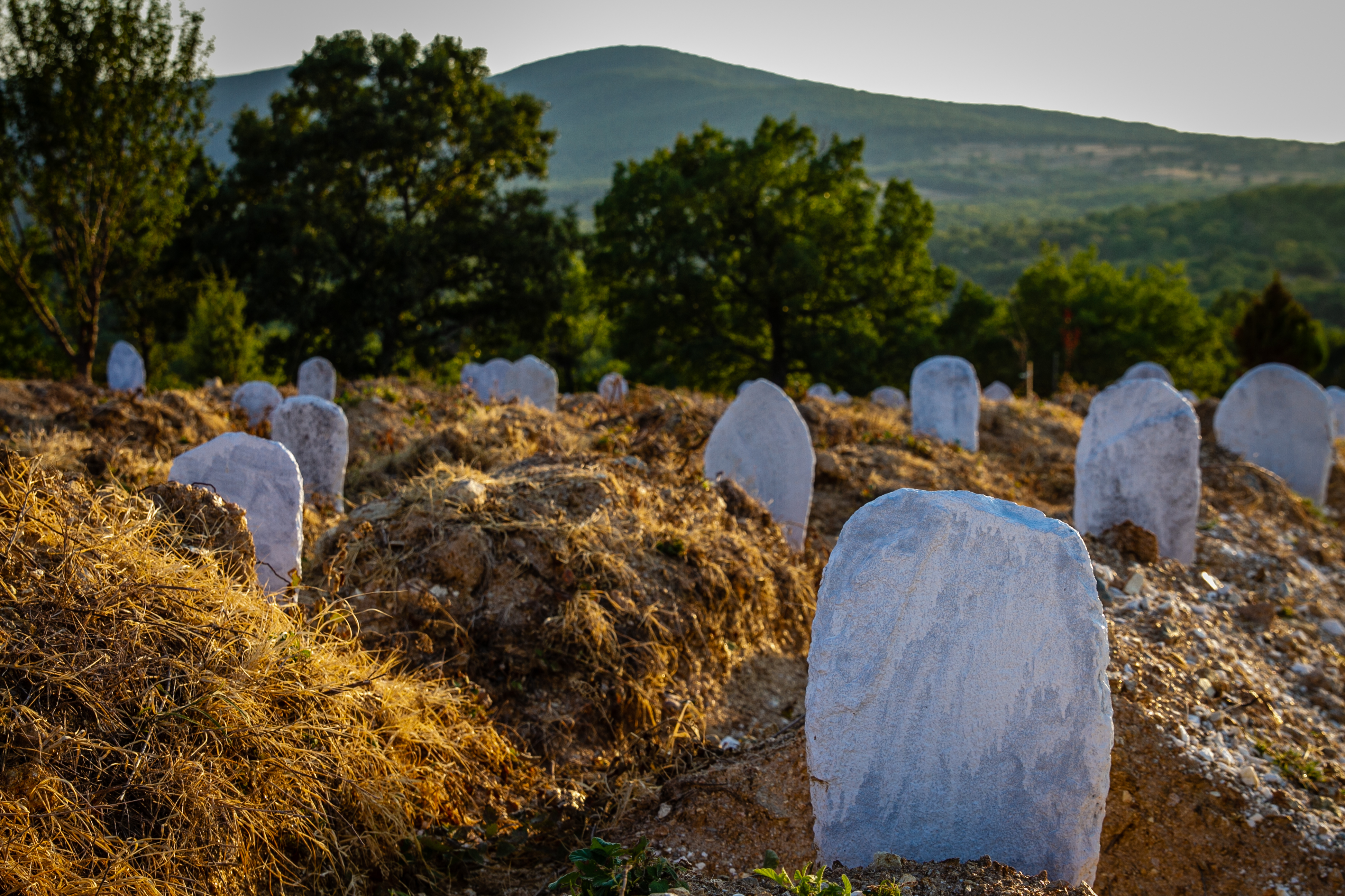 A graveyard in the hills above the Evros river is the final resting place for the many who die attempting the border crossing. The majority of the headstones mark unidentified bodies. (Lily Martin/CBC) 