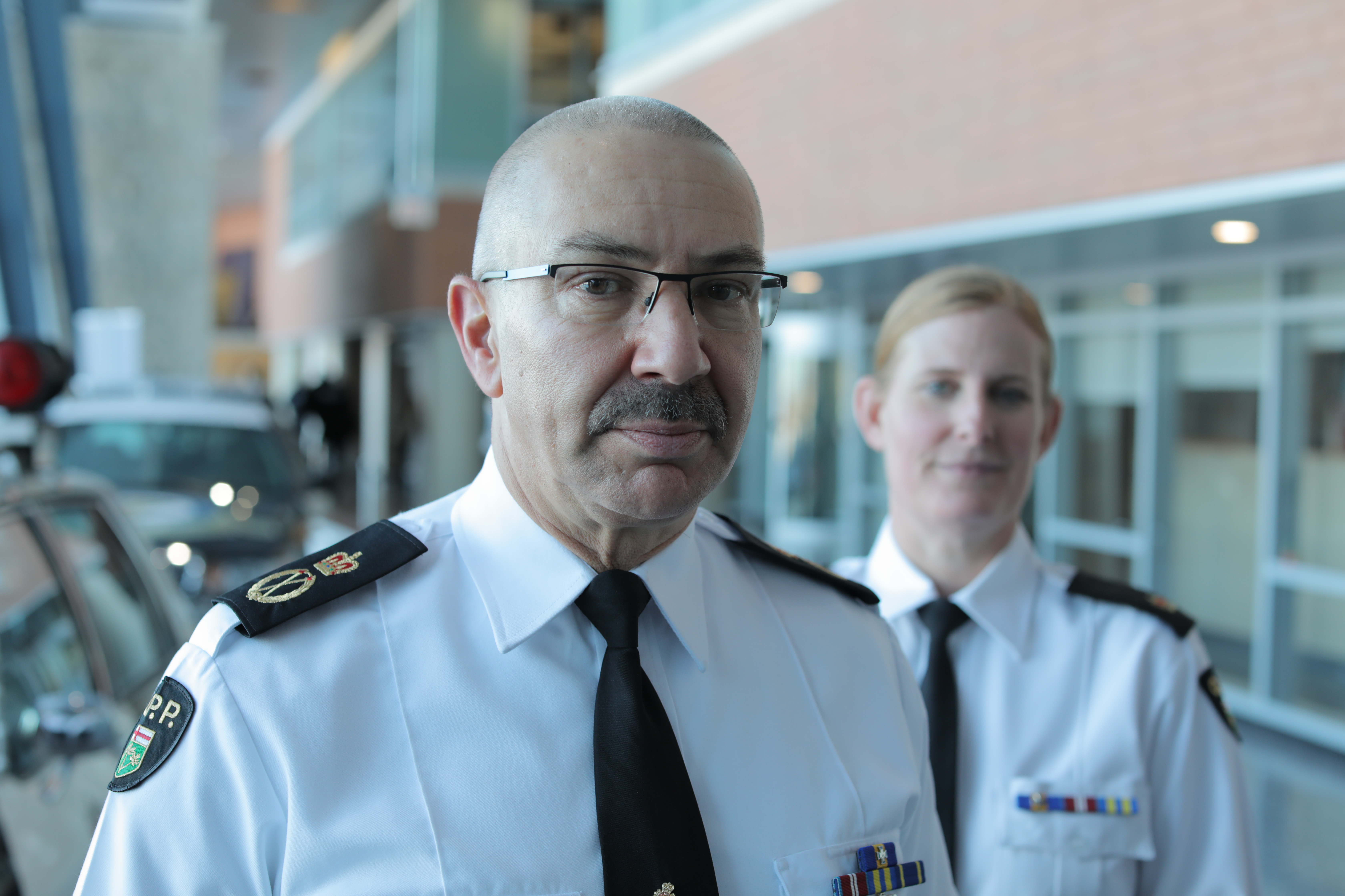 Acting OPP Commissioner Gary Couture and Insp. Robyn MacEachern, head of the force’s wellness unit, say the force has taken on new initiatives since the 2012 ombudsman's report, including a 23-member peer support program. (John Badcock/CBC)