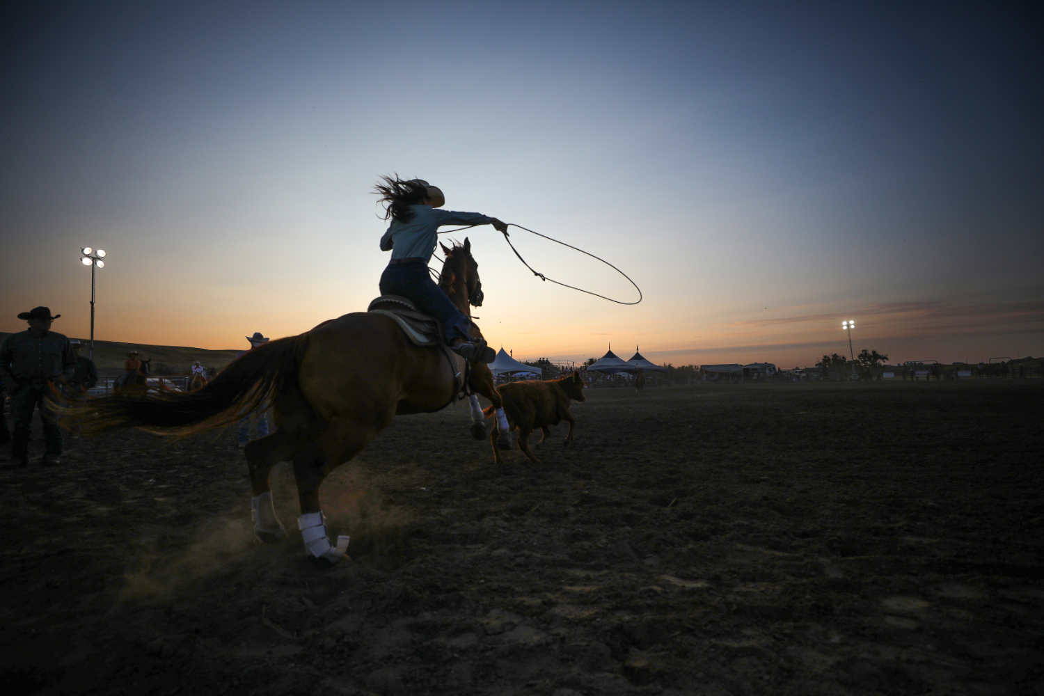 A competitor gets ready to fling her rope during the breakaway roping event.