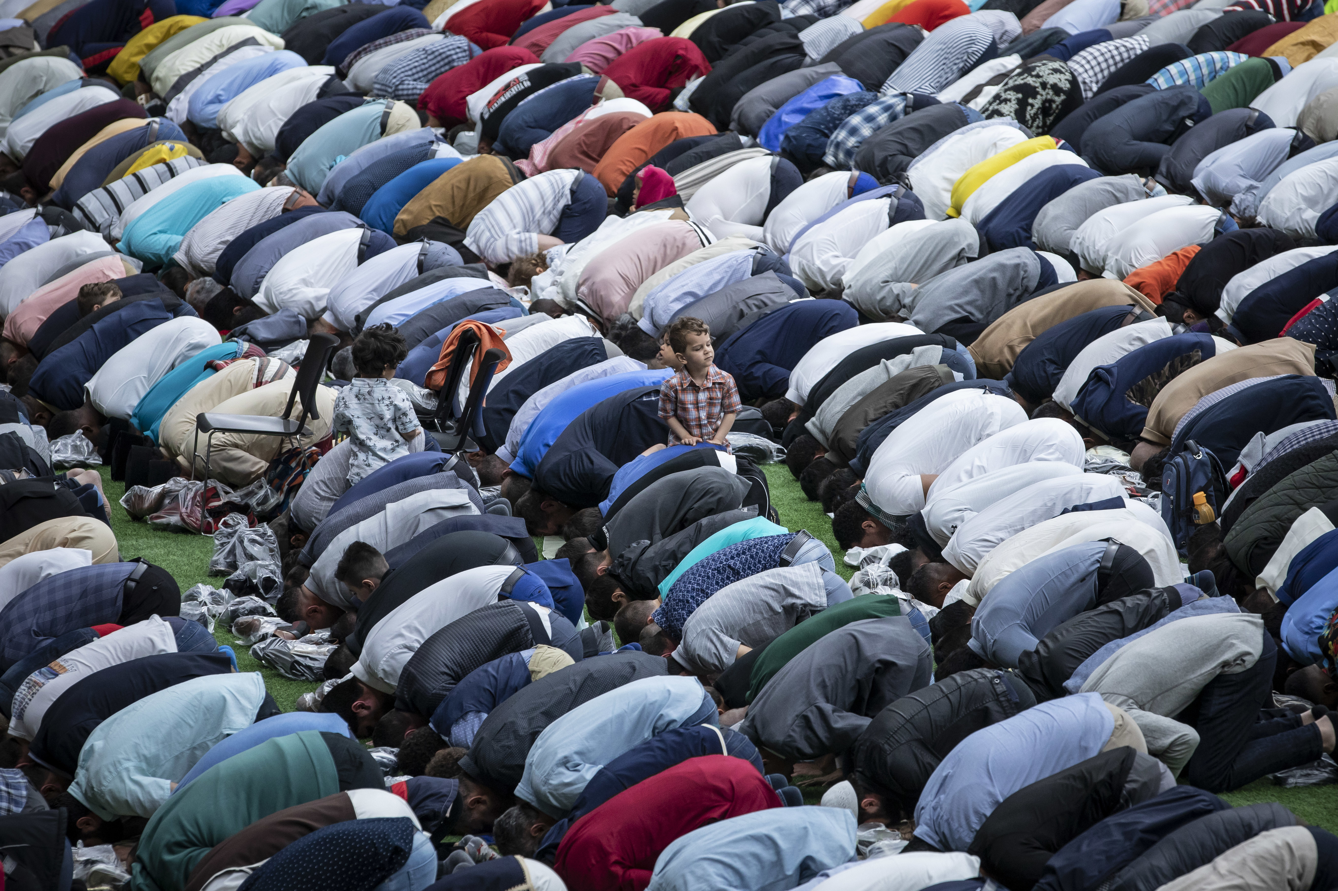 Muslims offer prayers during the first day of Eid al-Fitr, which marks the end of the holy fasting month of Ramadan, at B.C. Place in Vancouver on June 4, 2019. (Ben Nelms/CBC)