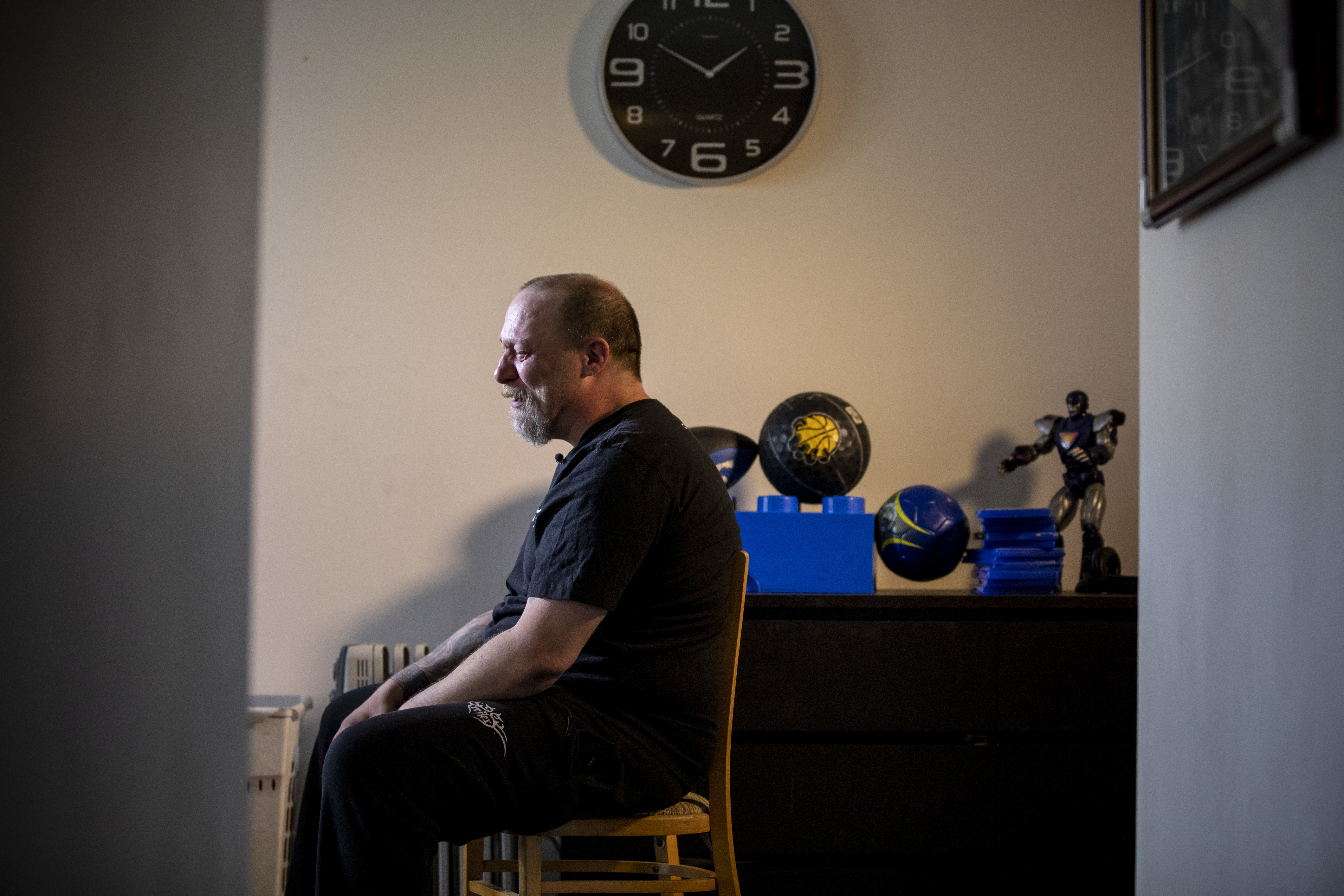 Aron Crimeni, father of 14-year-old Carson Crimeni who died of an apparent overdose, weeps while sitting in his son’s room in Langley, British Columbia on Aug. 9, 2019. (Ben Nelms/CBC)