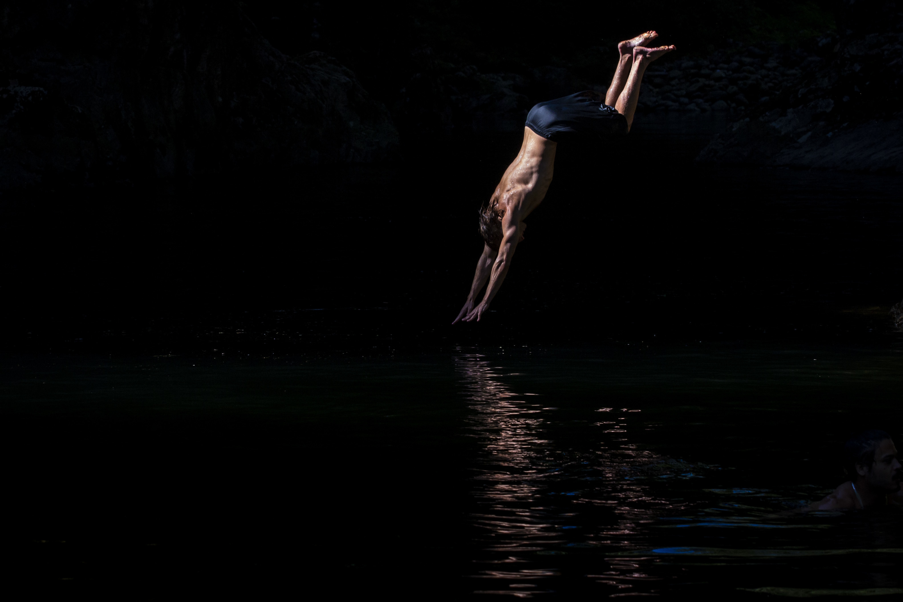 David Frank dives off a cliff into the Capilano river in North Vancouver, B.C., on Aug. 26, 2019. (Ben Nelms/CBC)