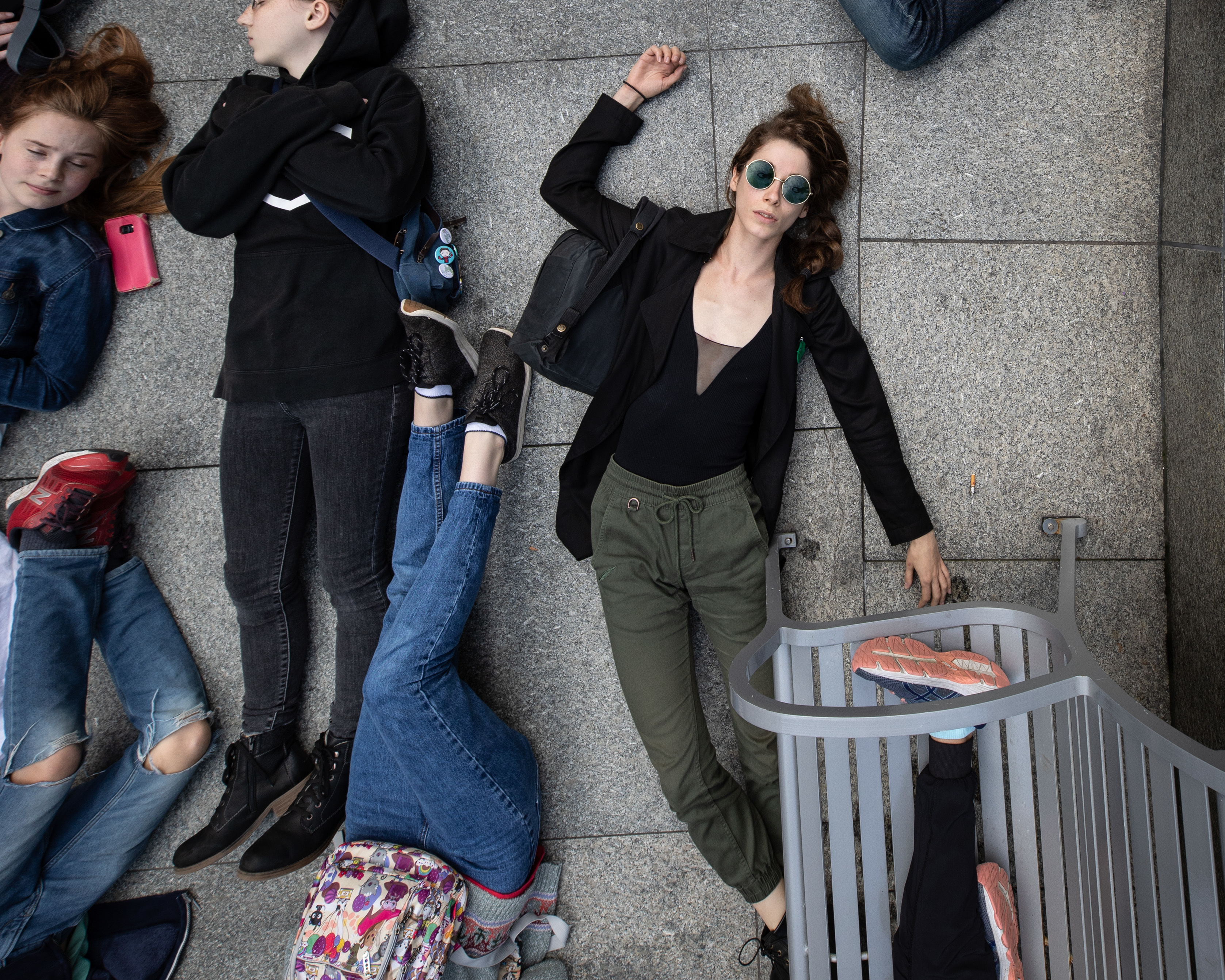 Climate activists perform a die-in outside the Teck Resources building on Sept. 20, 2019. (Maggie MacPherson/CBC)