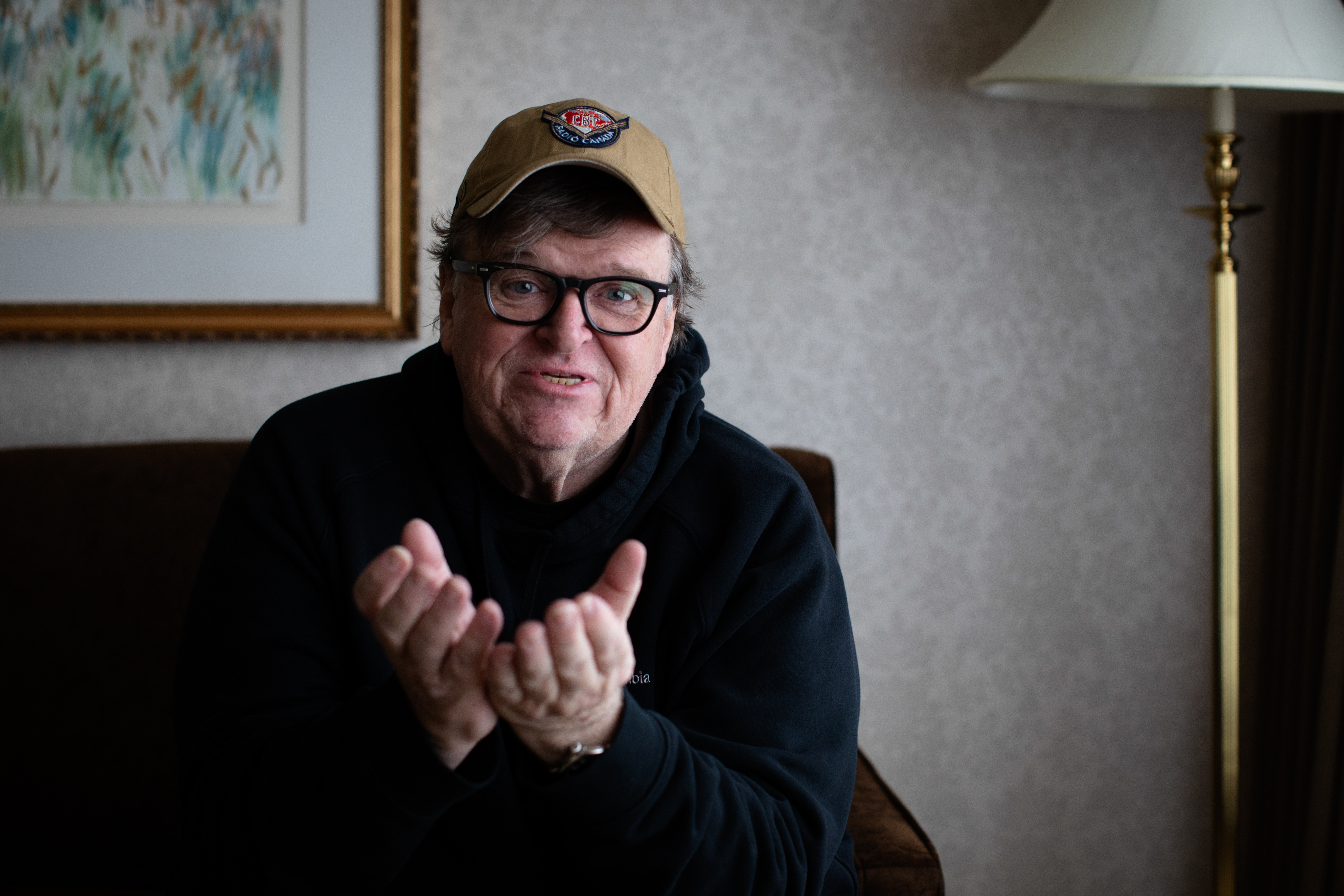 American documentary filmmaker Michael Moore tells a story in a Vancouver hotel room on  Oct. 4, 2019. (Maggie MacPherson/CBC)  