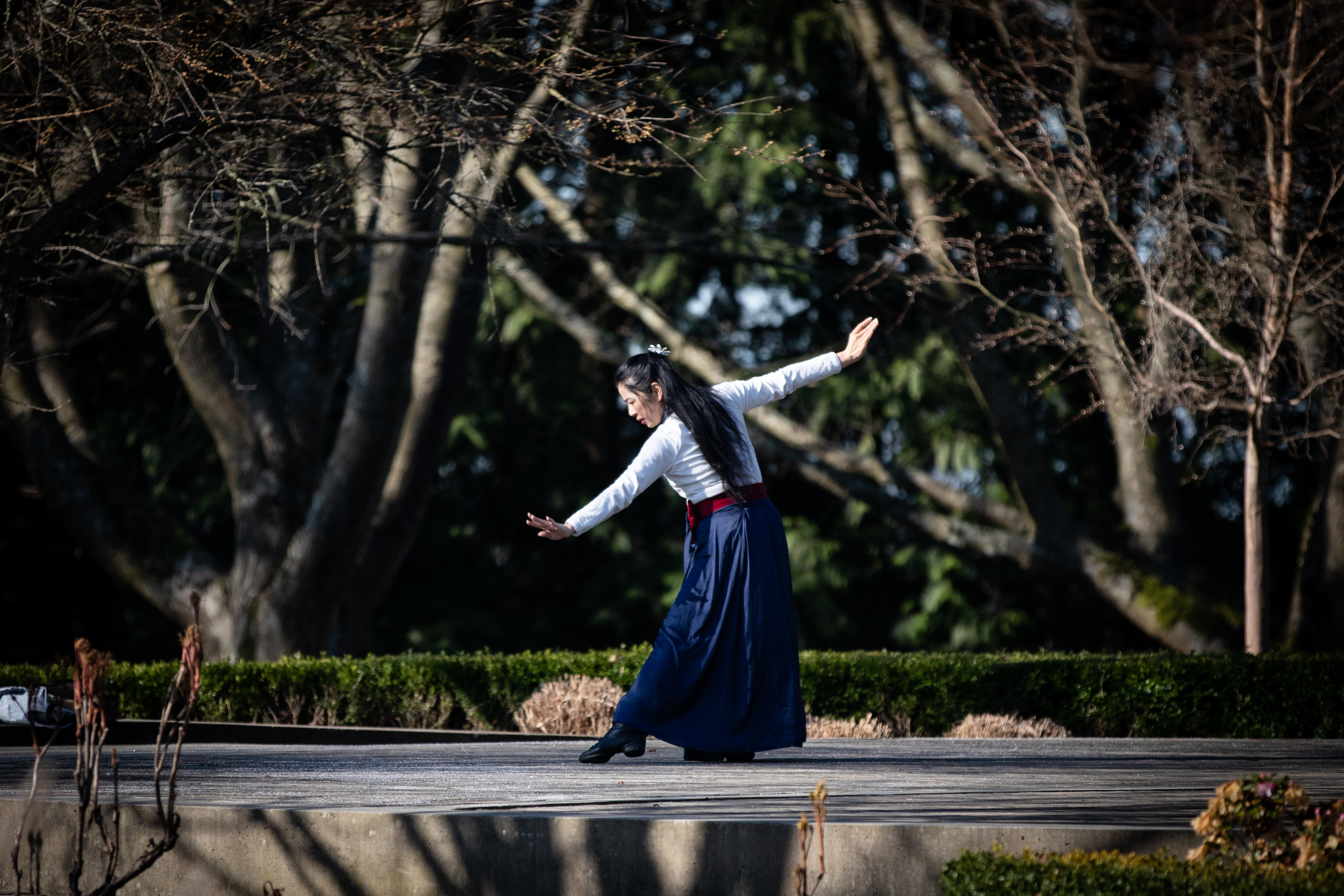 Ivy Bing practices Chinese folk dance in Queen Elizabeth Park in Vancouver on Wednesday, March 18, 2020. (Maggie MacPherson/CBC)