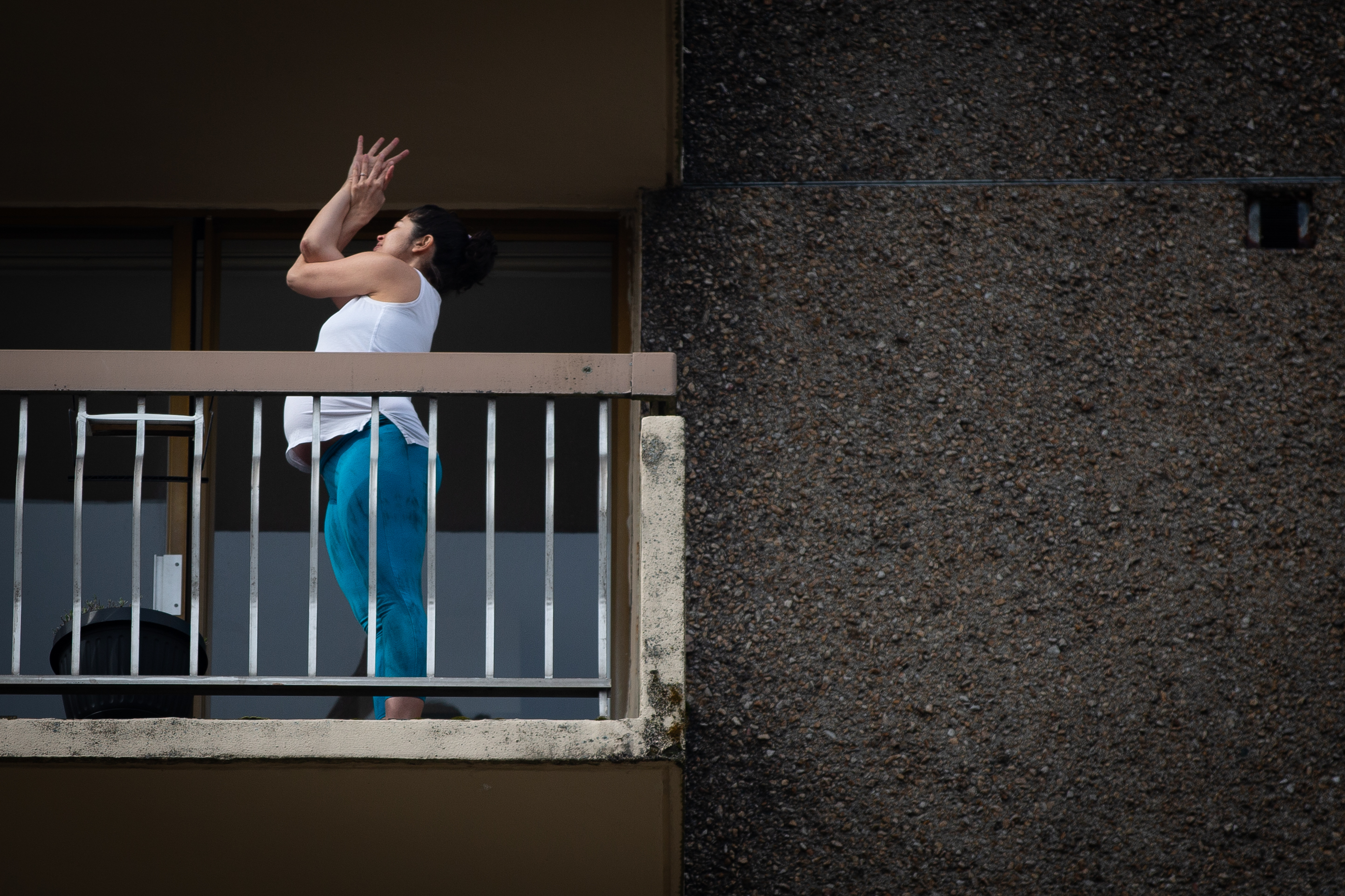 Roberts-Oss practises an arm bind on her balcony. 