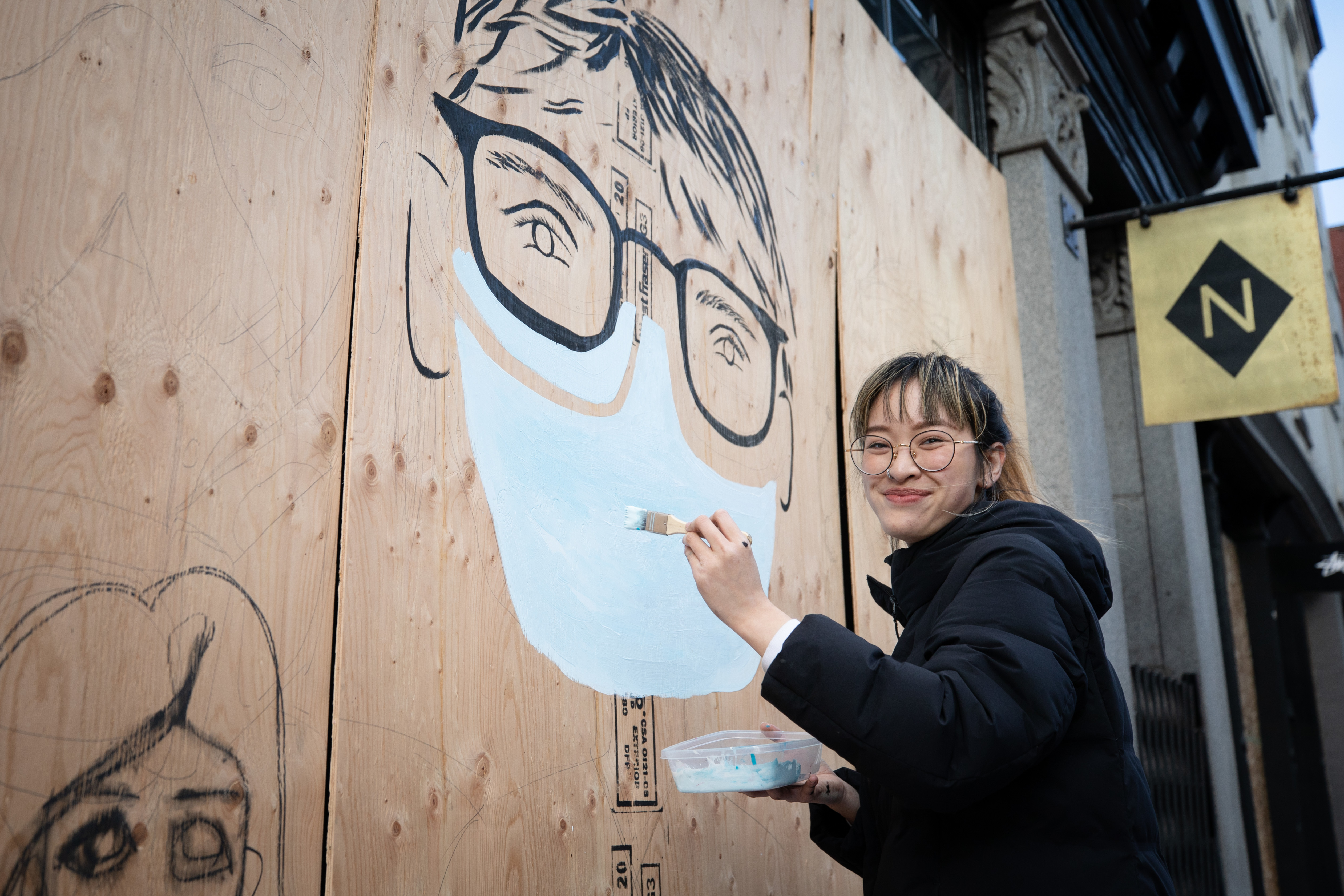 Izzie Cheung is a respiratory therapist who just finished her first four days at a new full-time job at Vancouver General Hospital. Her graduation was accelerated so she could qualify to help during the pandemic. Cheung says she was excited to do the mural since she is otherwise in isolation. She is painting three of her own colleagues.