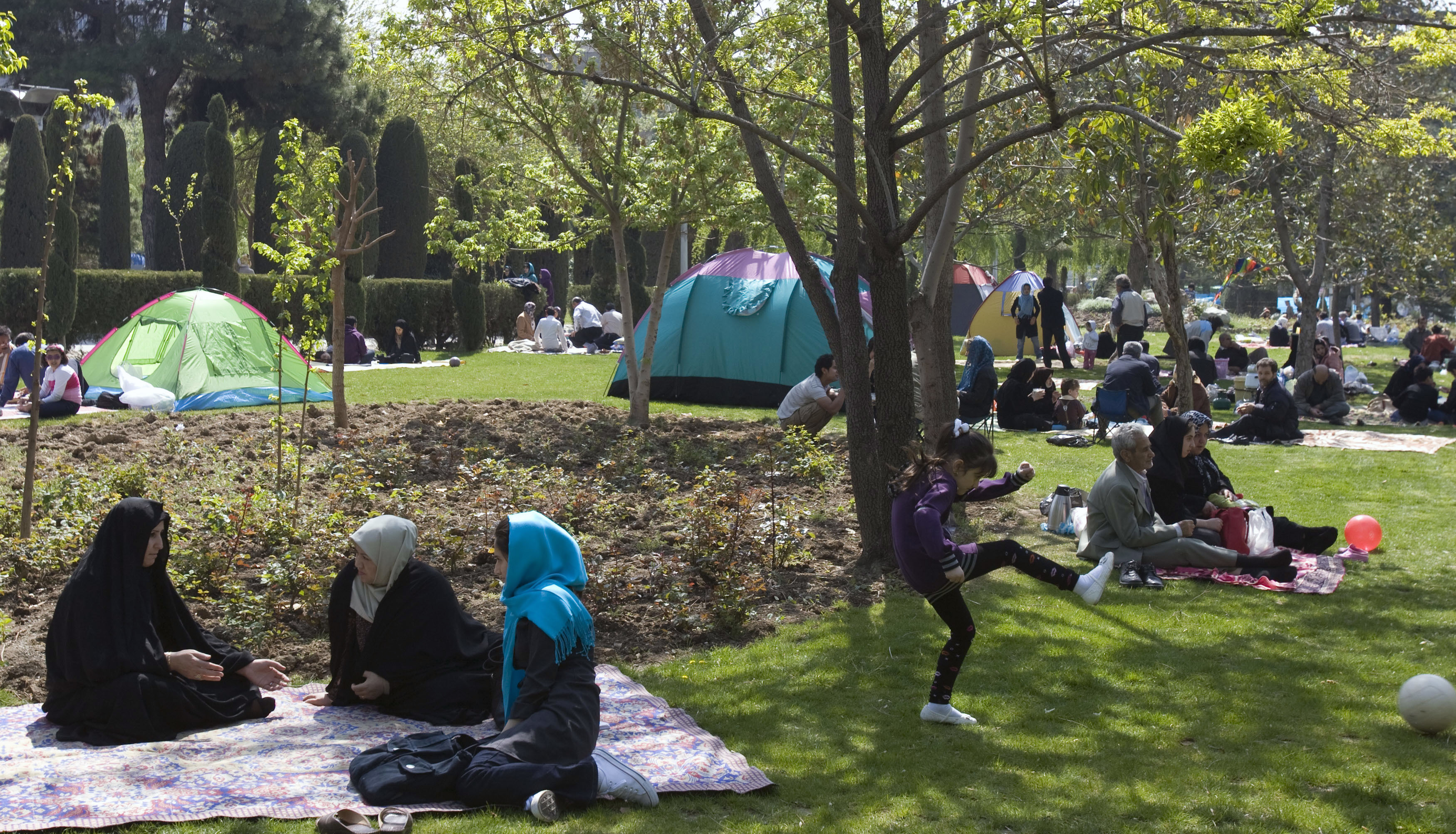 On Sizdah Bedar, the 13th day of the Persian New Year, Iranians believe it is a bad omen to stay indoors, and most people spend the day in nature and visiting cemeteries to honour deceased relatives. This photo was taken on April 2, 2009, in Tehran. (Raheb Homavandi/Iran Society/Reuters)