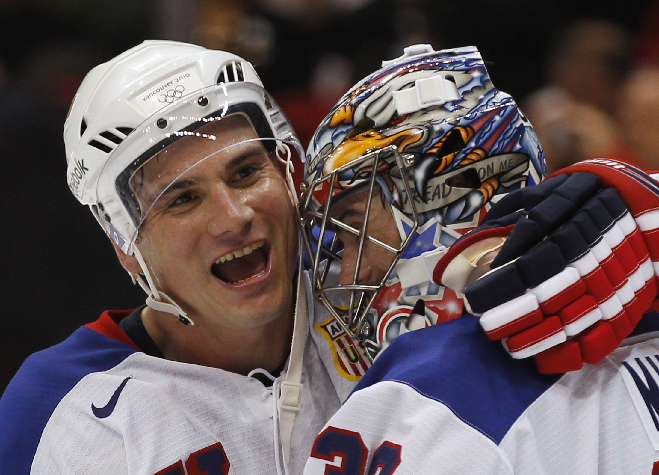 Team USA captain Jamie Langenbrunner, left, congratulates goalie Ryan Miller after their victory over Canada in a preliminary round game on Feb. 21, 2010. The loss led Team Canada to make a goaltending change midway through the tournament, as Roberto Luongo took the net in place of Martin Brodeur. (Hans Deryk/Reuters)