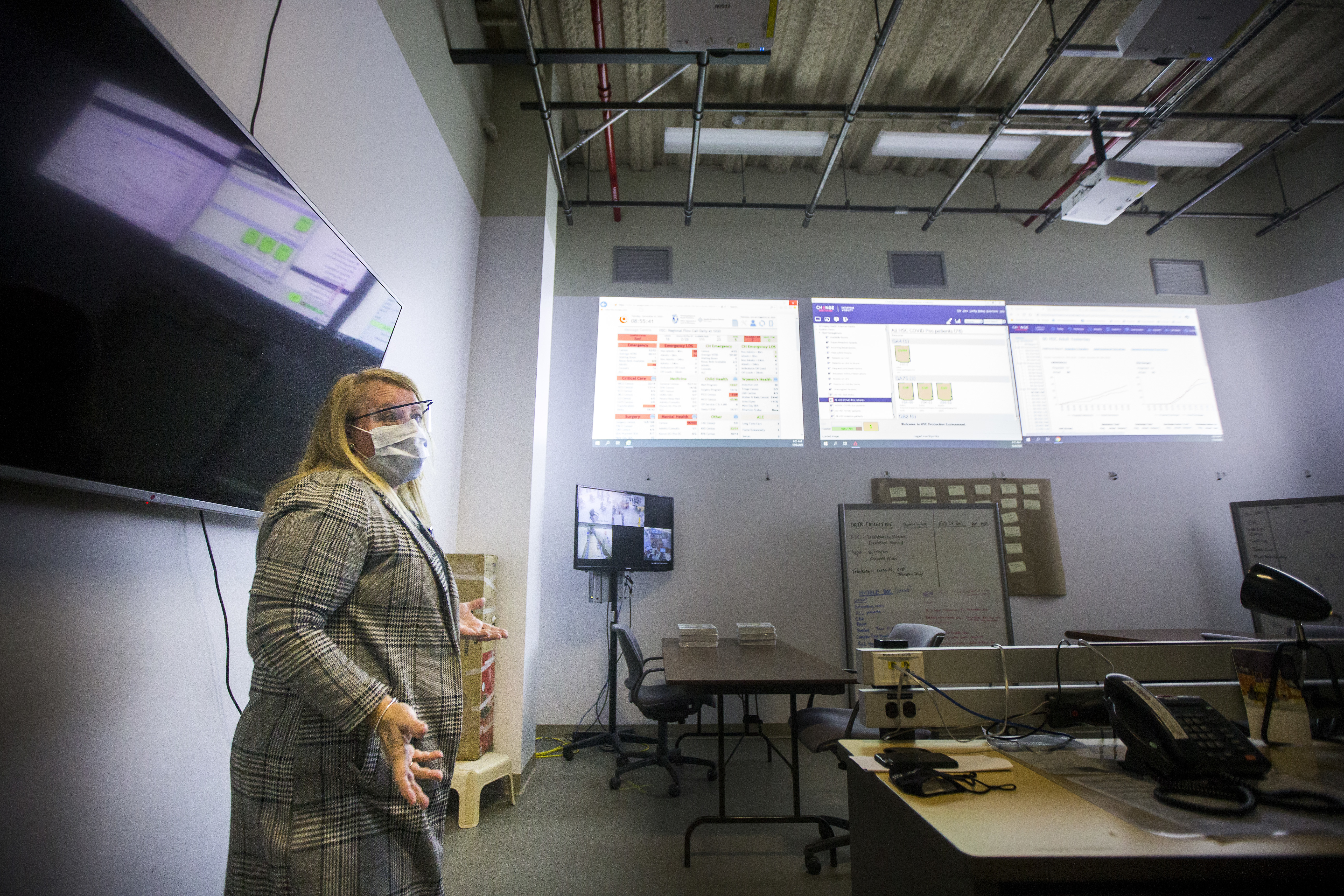 Jennifer Cumpsty, acting chief nursing officer for HSC, describes the purpose of the hospital command centre where they strategize the movement of patients every morning. (Mikaela MacKenzie/Winnipeg Free Press/Canadian Press)