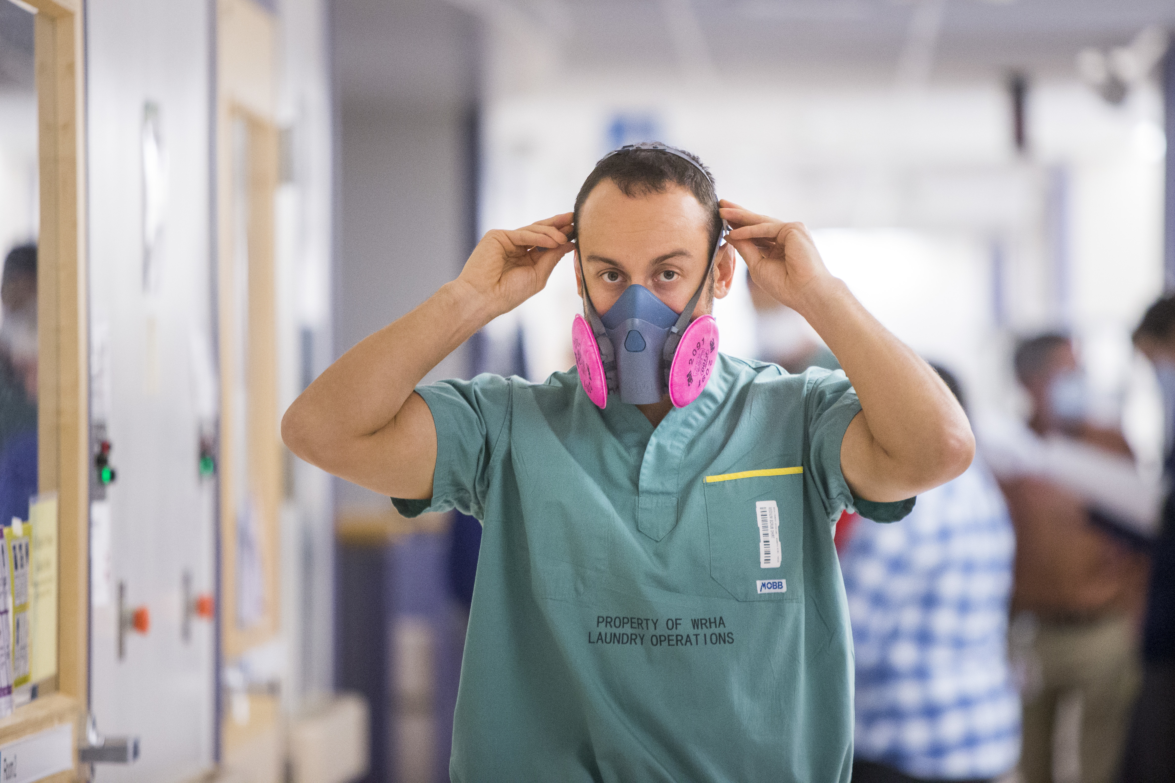 Health-care workers are dealing with long hours and juggling many patients at once in their fight against the contagious coronavirus. (Mikaela MacKenzie/Winnipeg Free Press/Canadian Press)