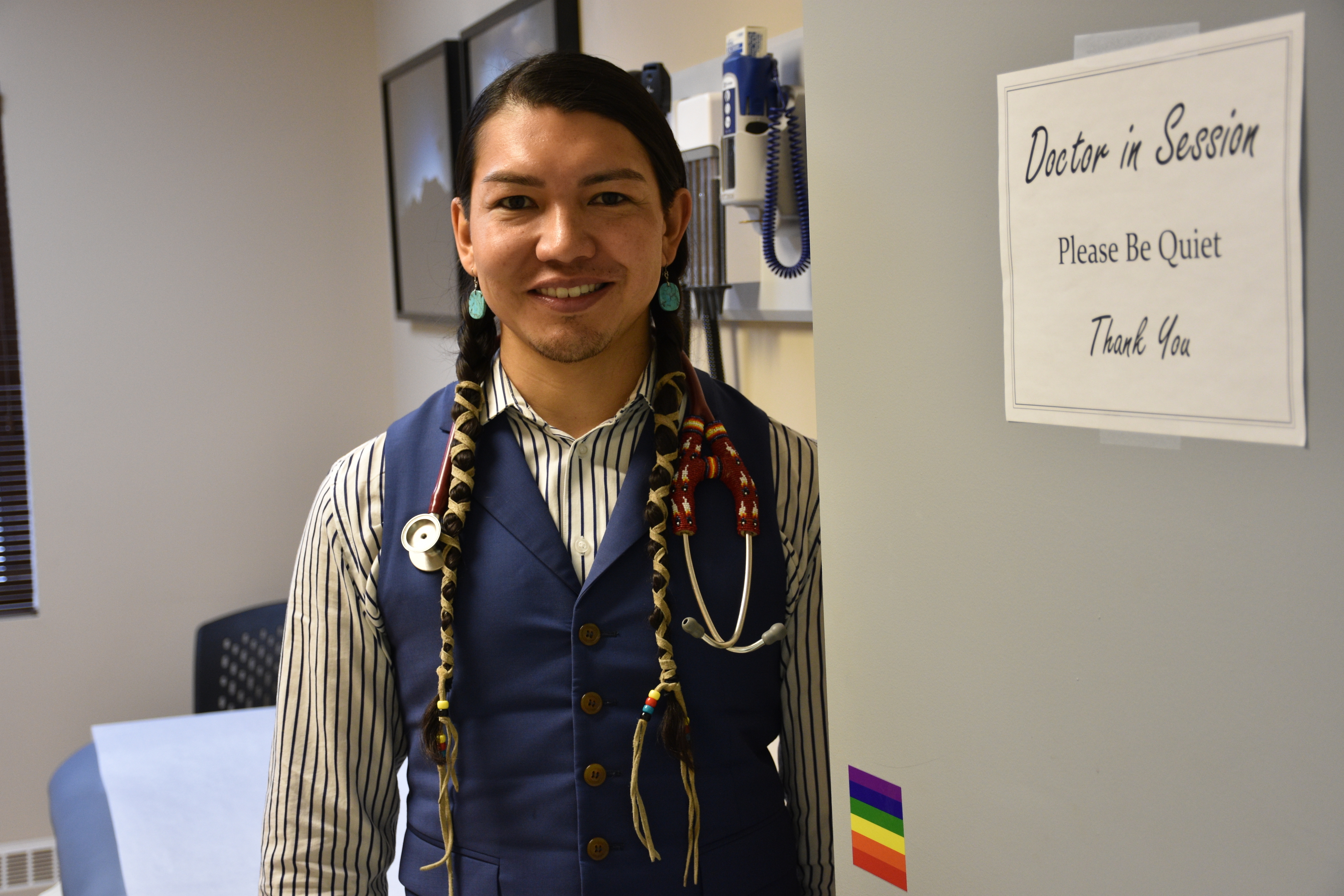 Dr. James Makokis proudly displays the Rainbow Flag, a symbol of the LGBT2 movement, on the door of his examination room at the Enoch Health Centre. (Terry Reith/CBC)