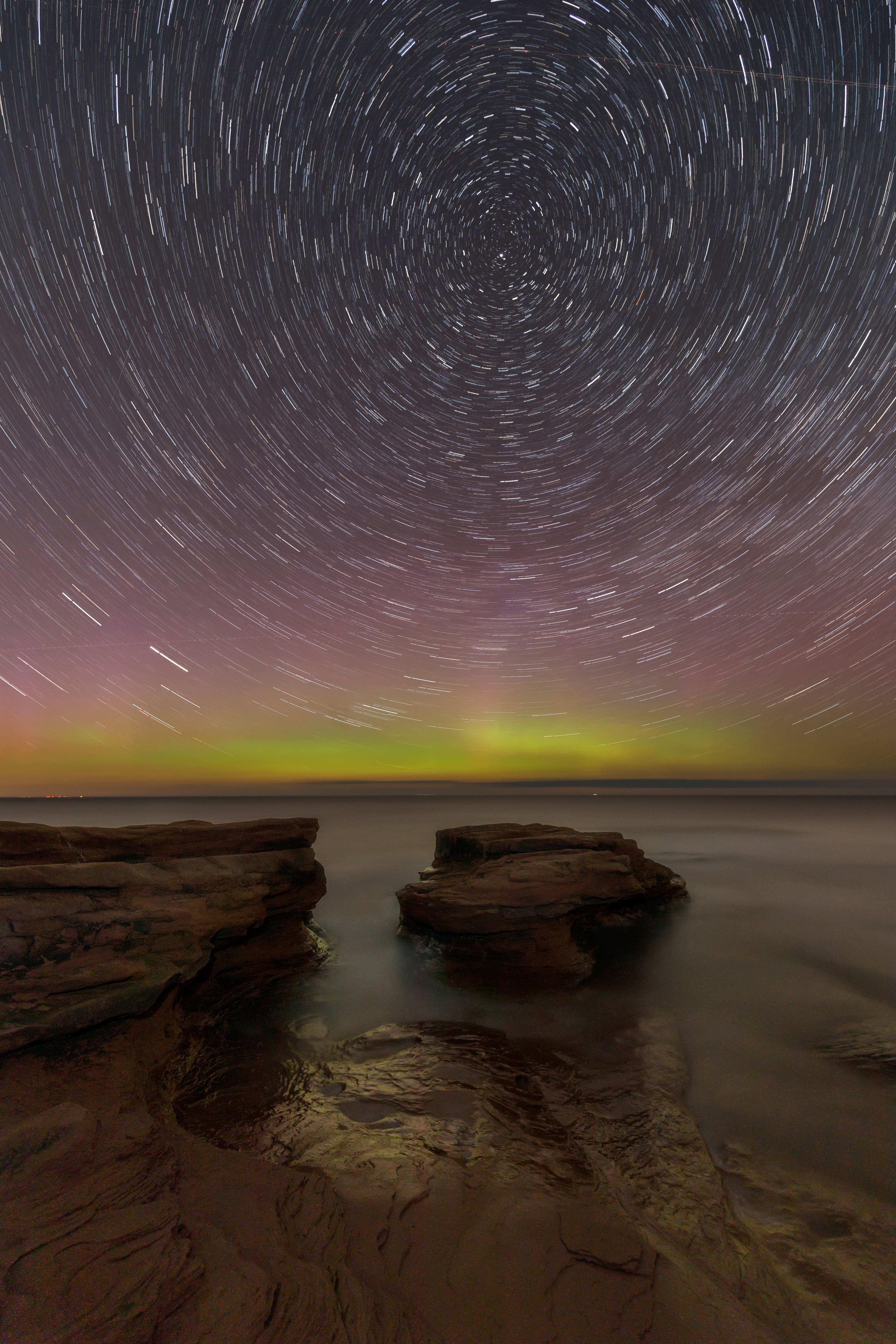 Star trails are the effects of a long exposure. It only takes a couple minutes for the rotation of the Earth to create streaks of light in the sky circling around the North Star. (Stephen DesRoches)