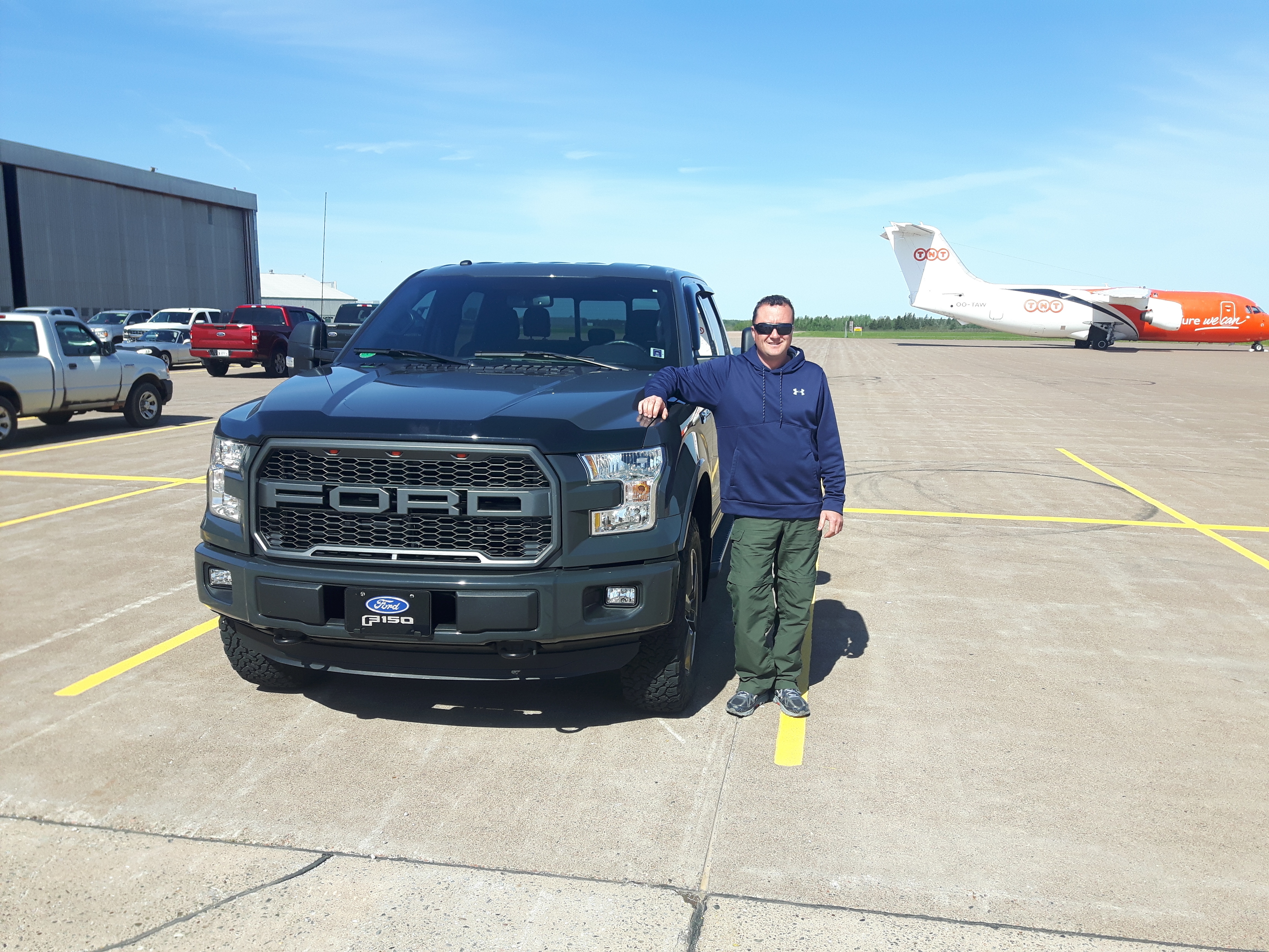 Shawn MacKendrick has spent about $1,000 to replace smashed driving lights and touch up some of the paint chips on his 2016 F-150 truck and he still has to get his cracked windshield replaced. He says it is 'littered with hundreds of little chips.' (Submitted by Shawn MacKendrick)