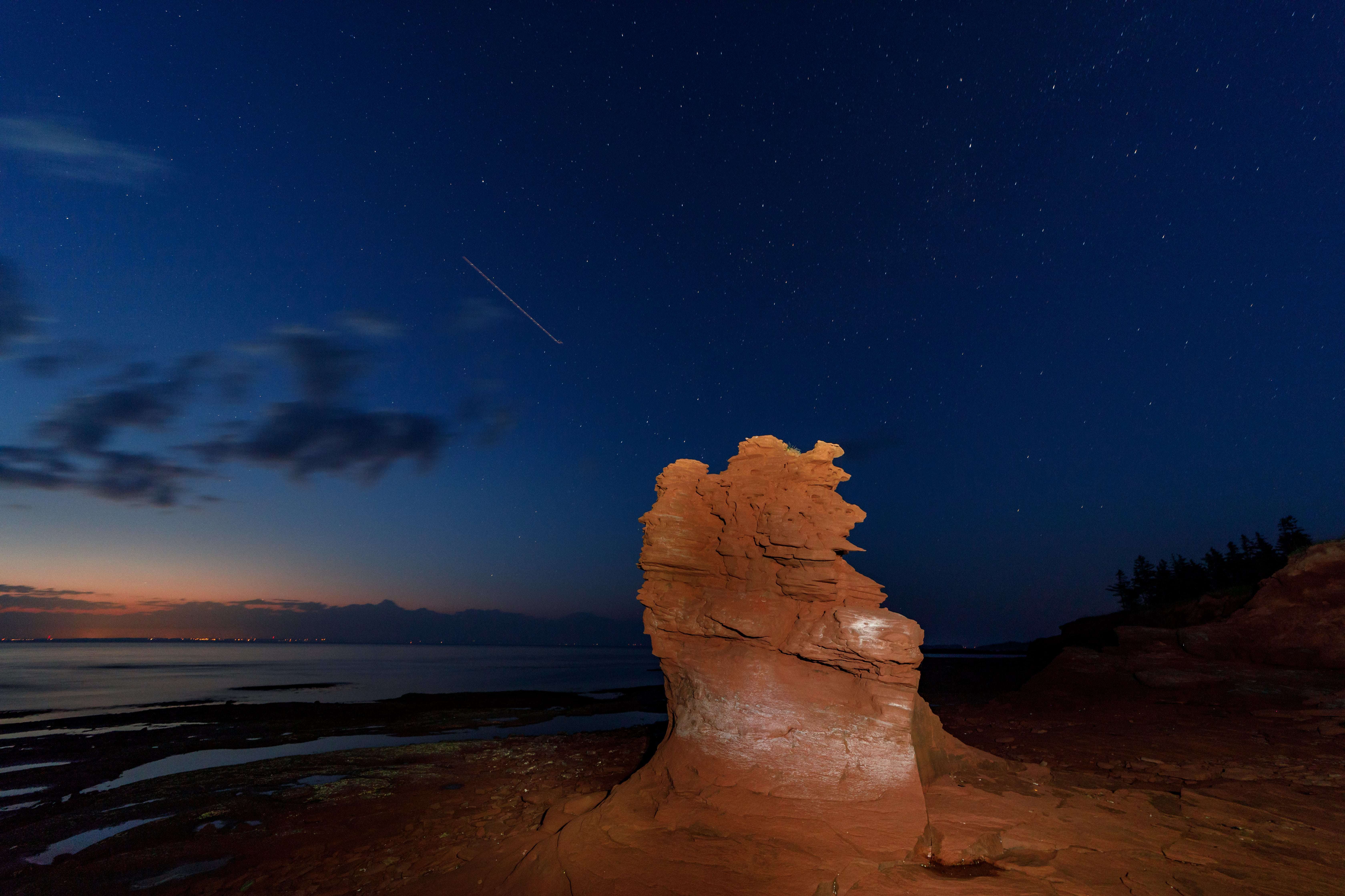 Artificial light sources can be used to introduce interest. This rock formation would be nothing more than a black shadow without some light painting from a flashlight. (Stephen DesRoches)