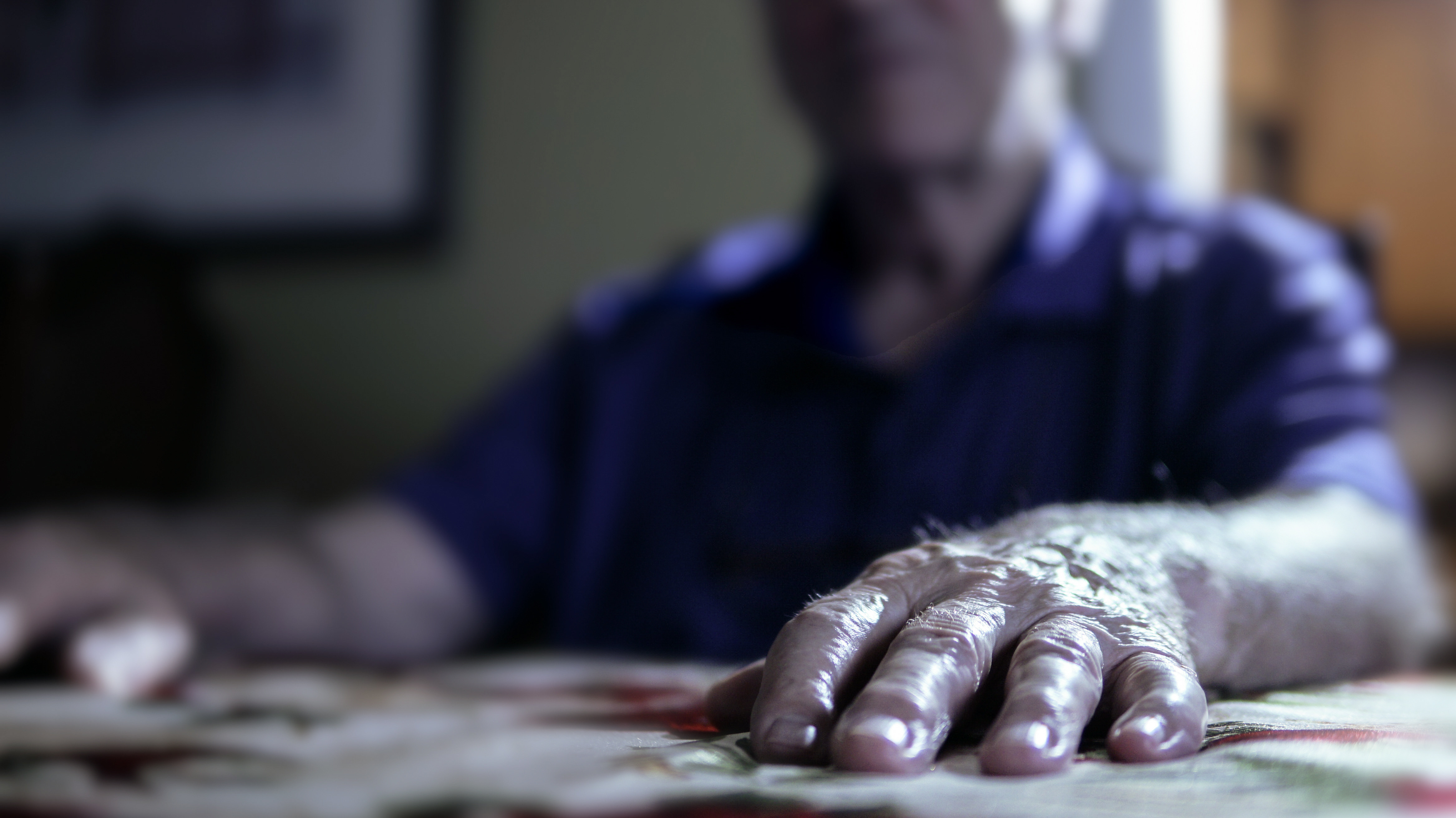 John Doe No. 26 sits in the dining room of his home, rehashing the worst details of his time at Mount Cashel. (Ryan Cooke/CBC)