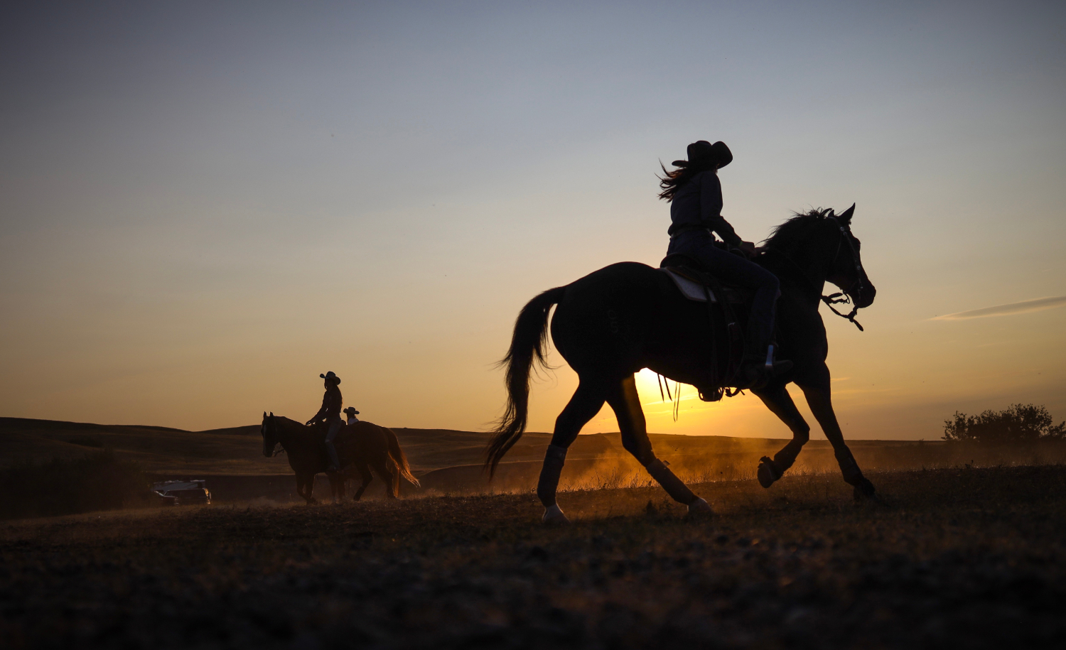 Barrel racers warm up before competing in the rodeo.