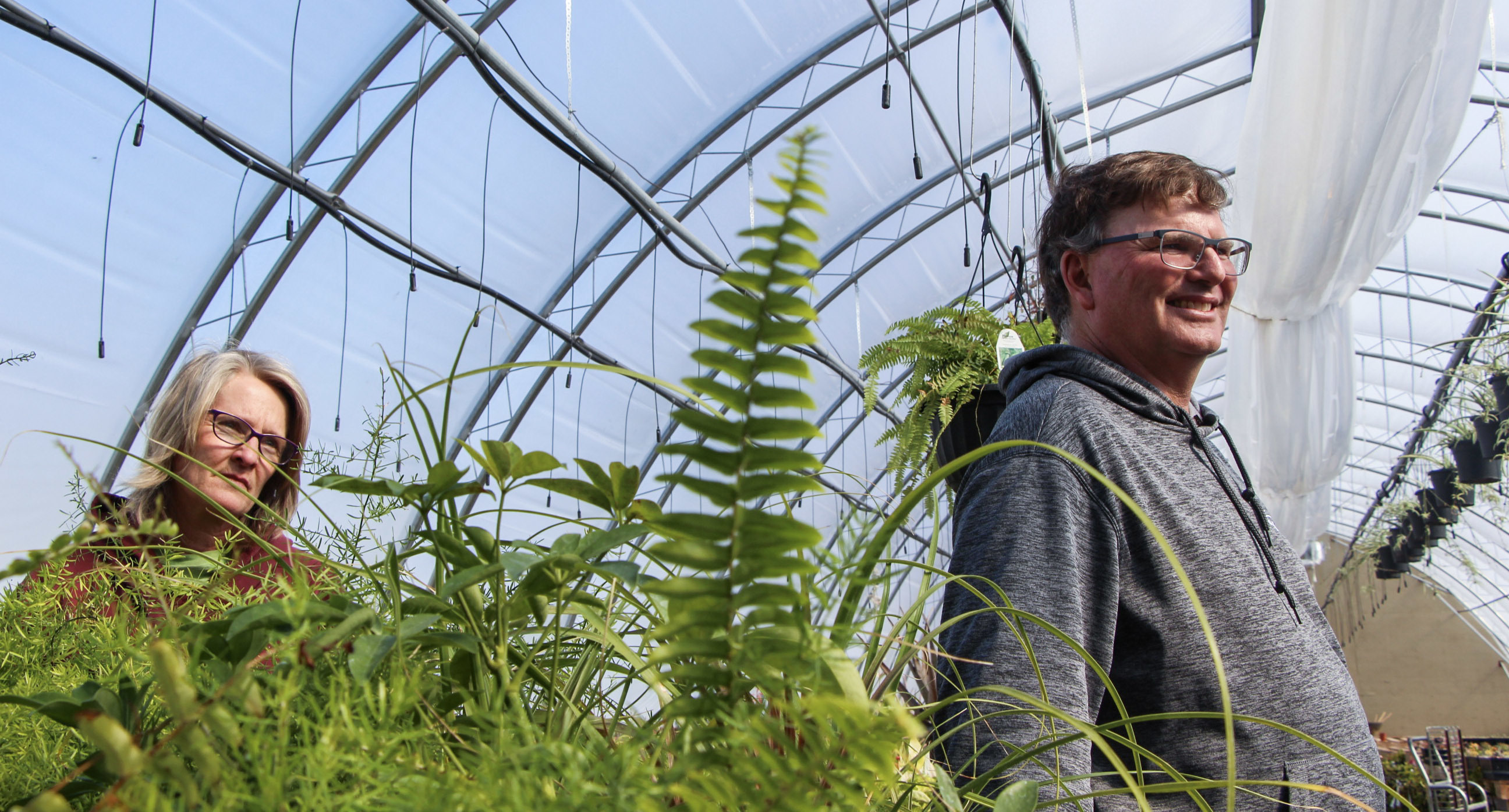 Rob and Sue MacLeod are adamant: they will not evacuate their land, due to the high levels of stock currently in the greenhouses. (Ahmar Khan/CBC)