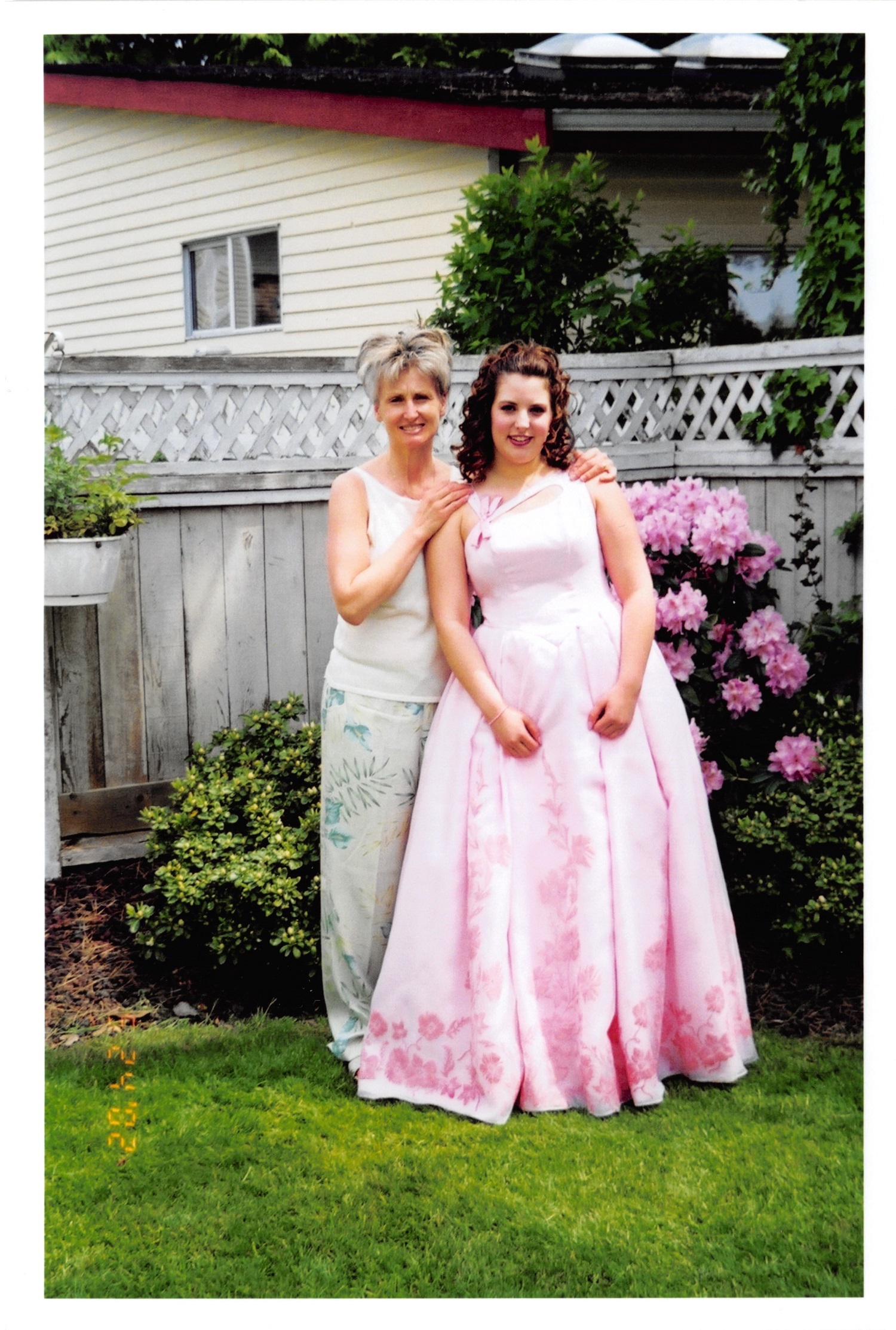 Jessica Woudzia posing with her mother Kathy on the day of her high school prom. (Submitted by Kathy Woudzia)