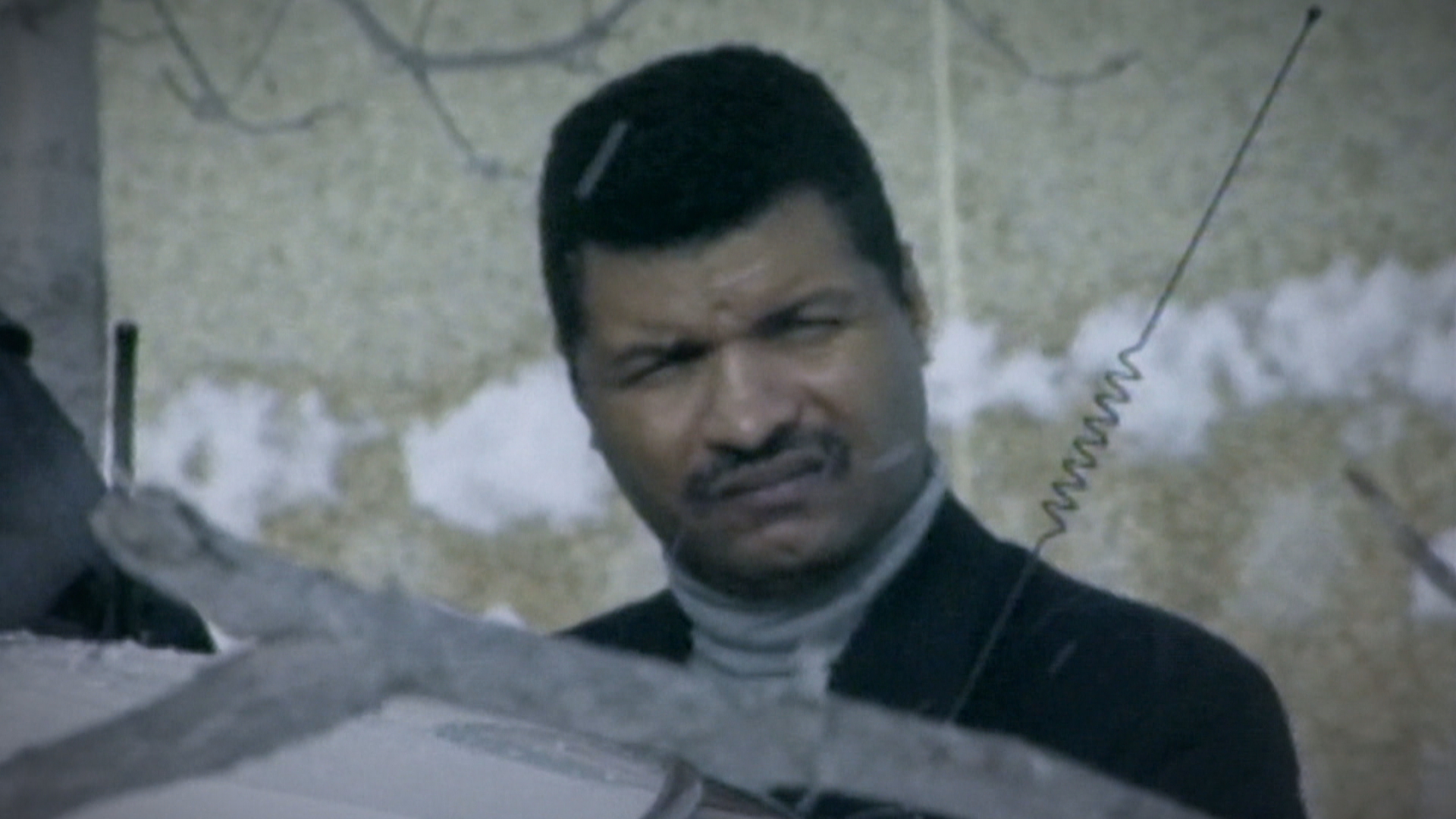 Dale Ogden standing outside a police cruiser following his arrest for murder. (CBC)