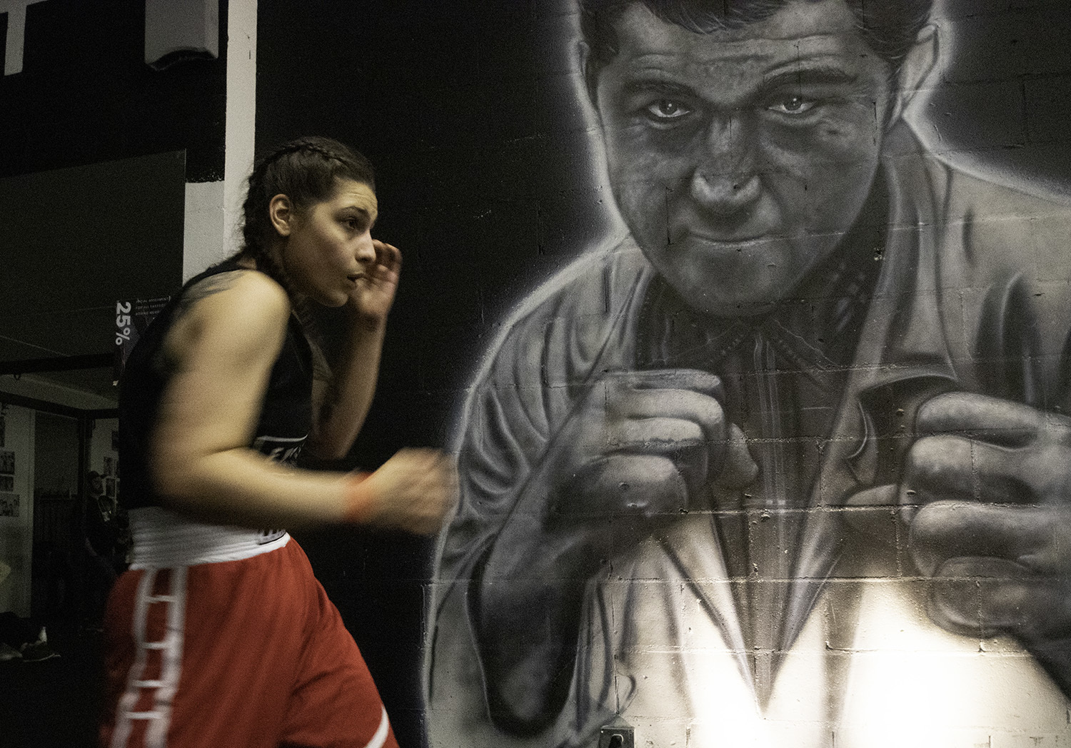 Catherine Accardi shadow boxes to warm up before her fight. Accardi used to do ballet, but she now prefers to box. (Maryse Zeidler/CBC)