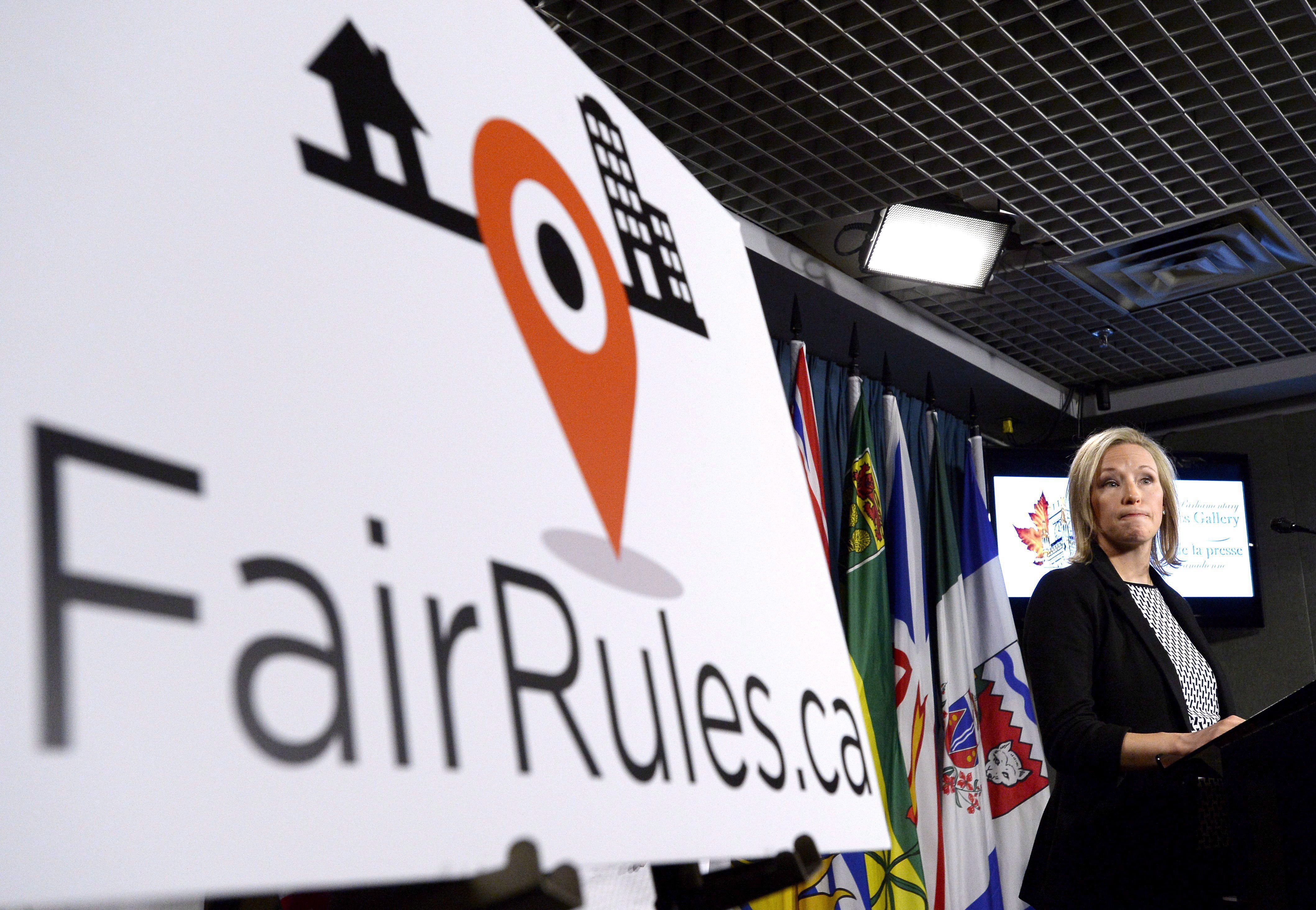 Susie Grynol, president of the Hotel Association of Canada, speaks at a press conference April 30 in Ottawa calling on the federal government to take action on tax avoidance by digital platforms such as Airbnb. (Justin Ling/Canadian Press)