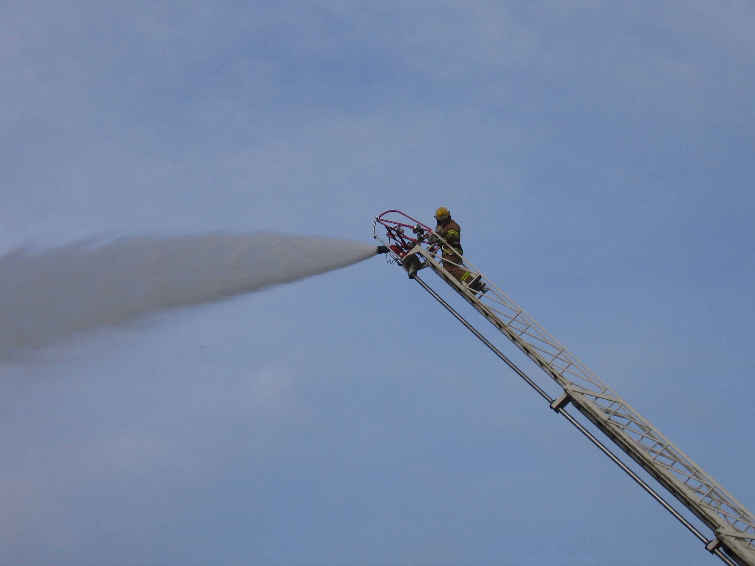 Retired captain Anwer Amery fights a fire in a training situation with colleagues. Amery, a BIPOC firefighter, says he faced abuse in the firehalls 'right from the beginning.' (Submitted by Anwer Amery)