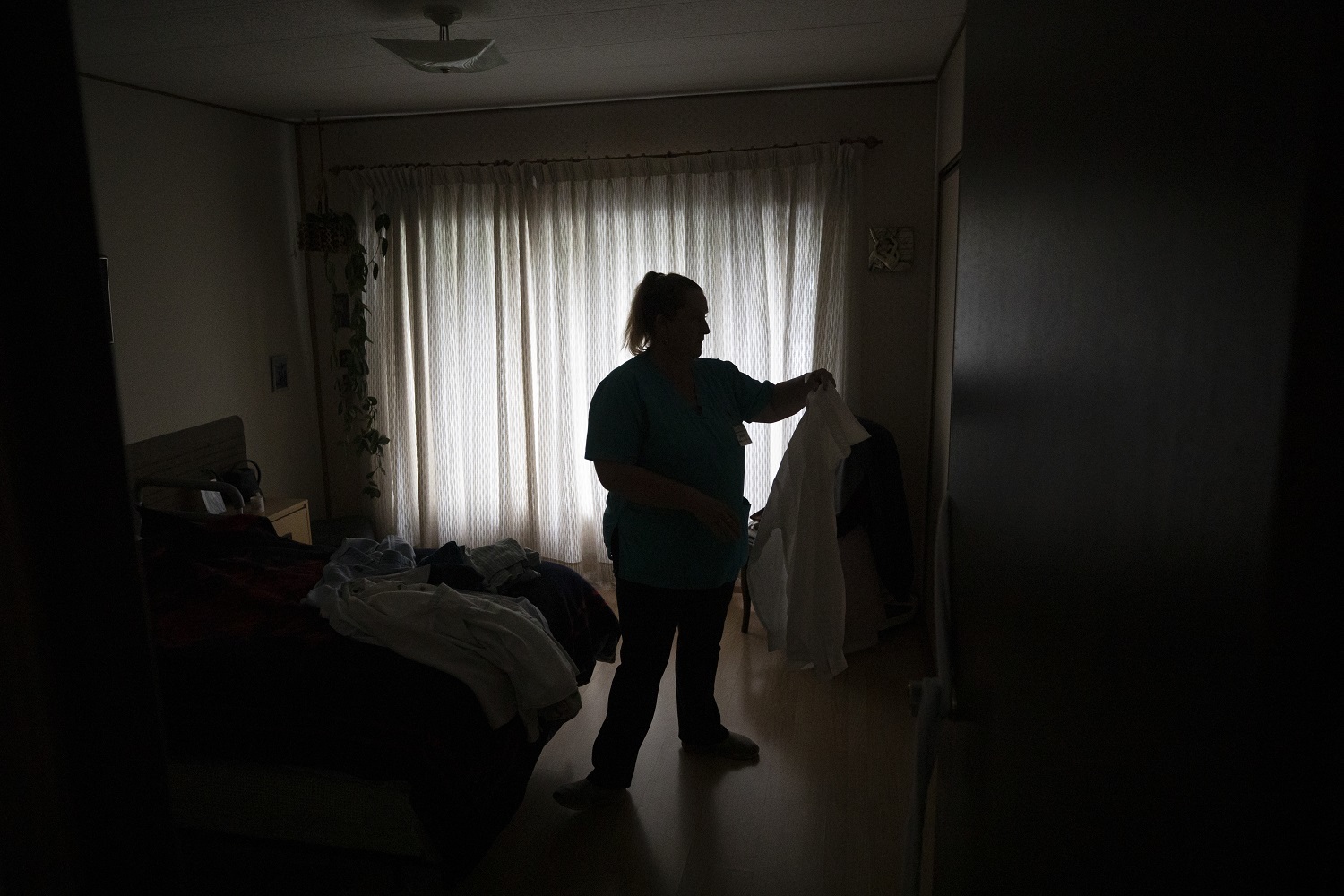 Care worker Jenny Kaastra works until late, with her shift totaling 12 hours. (Ben Nelms/CBC)