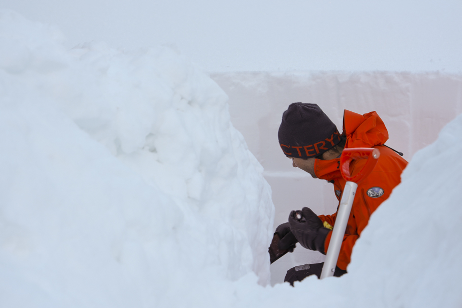 Avalanche technician, Alex Richardson, does a snow profile to see how the various layers of snow are bonding with each other. (Tina Lovgreen/CBC)