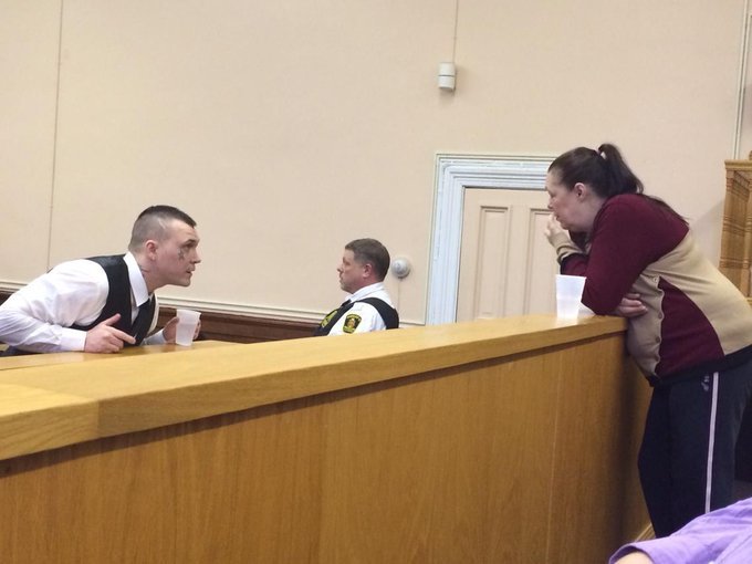 Philip Pynn turns around in the prisoner's box to speak to his mother, Loretta, in the courtroom gallery at Newfoundland and Labrador Supreme Court in 2015. (Ariana Kelland/CBC)