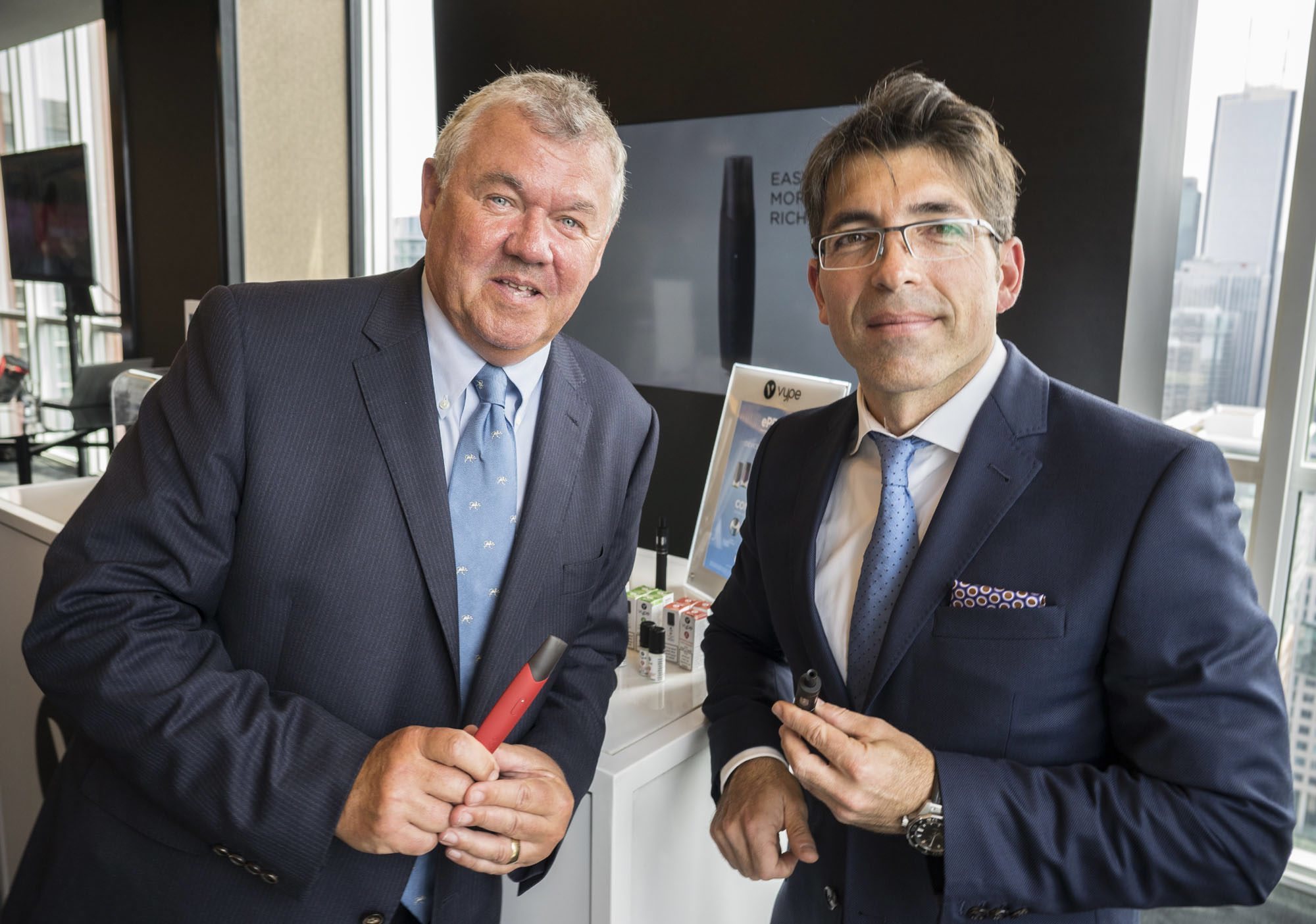 Chris Proctor, chief scientific officer of British American Tobacco, left, and Jorge Araya, president and CEO of Imperial Tobacco Canada, a subsidiary of BAT, announcing a national roll-out of Vype vaping products in Toronto in May 2018. (Imperial Tobacco Canada/The Canadian Press)