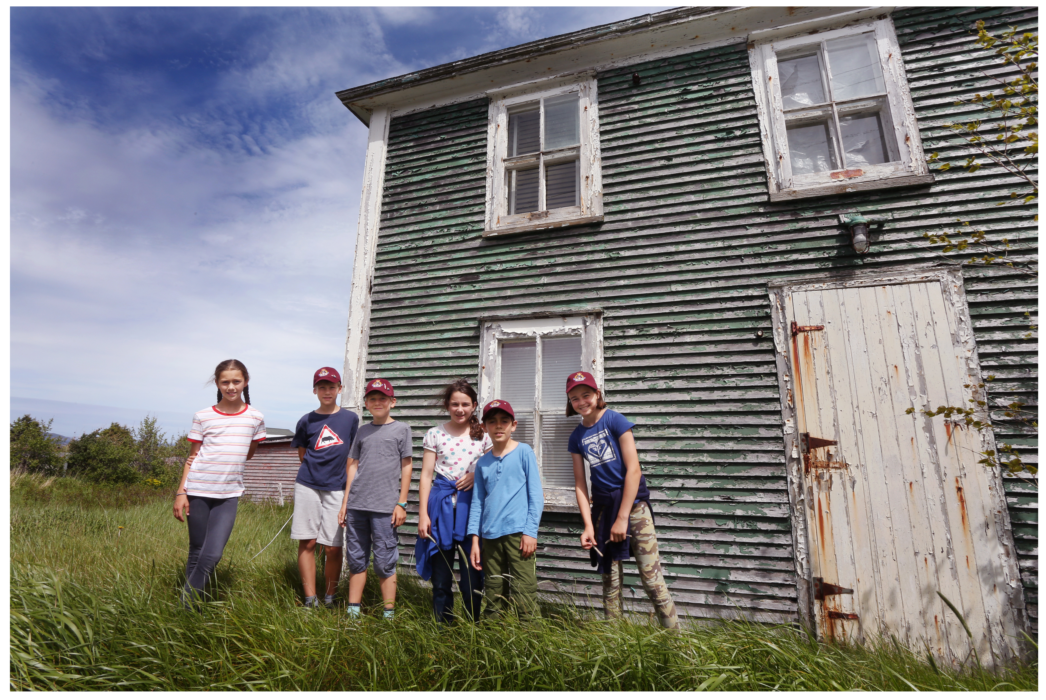 Students Sophia Anderson, George Overy, Oscar Heard, Alice Goldberger, Sasha Cellino and Zoe Spenceley at the home of Silas Edgecombe in Ochre Pit Cove. (Paul Daly for CBC)