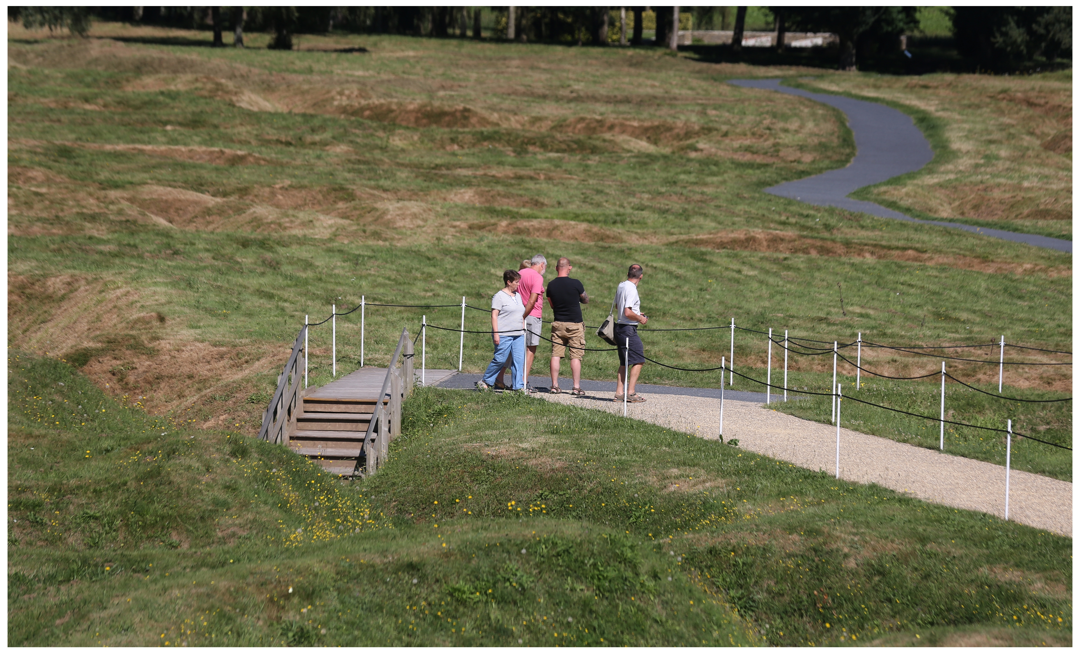 A group of tourists walk out of the trenches at Beaumont-Hamel. (Paul Daly) 