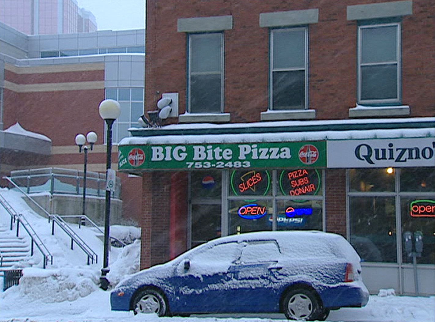 Big Bite Pizza, a small shop that formerly operated on Water Street, was the focus of a police investigation into child exploitation. (CBC)