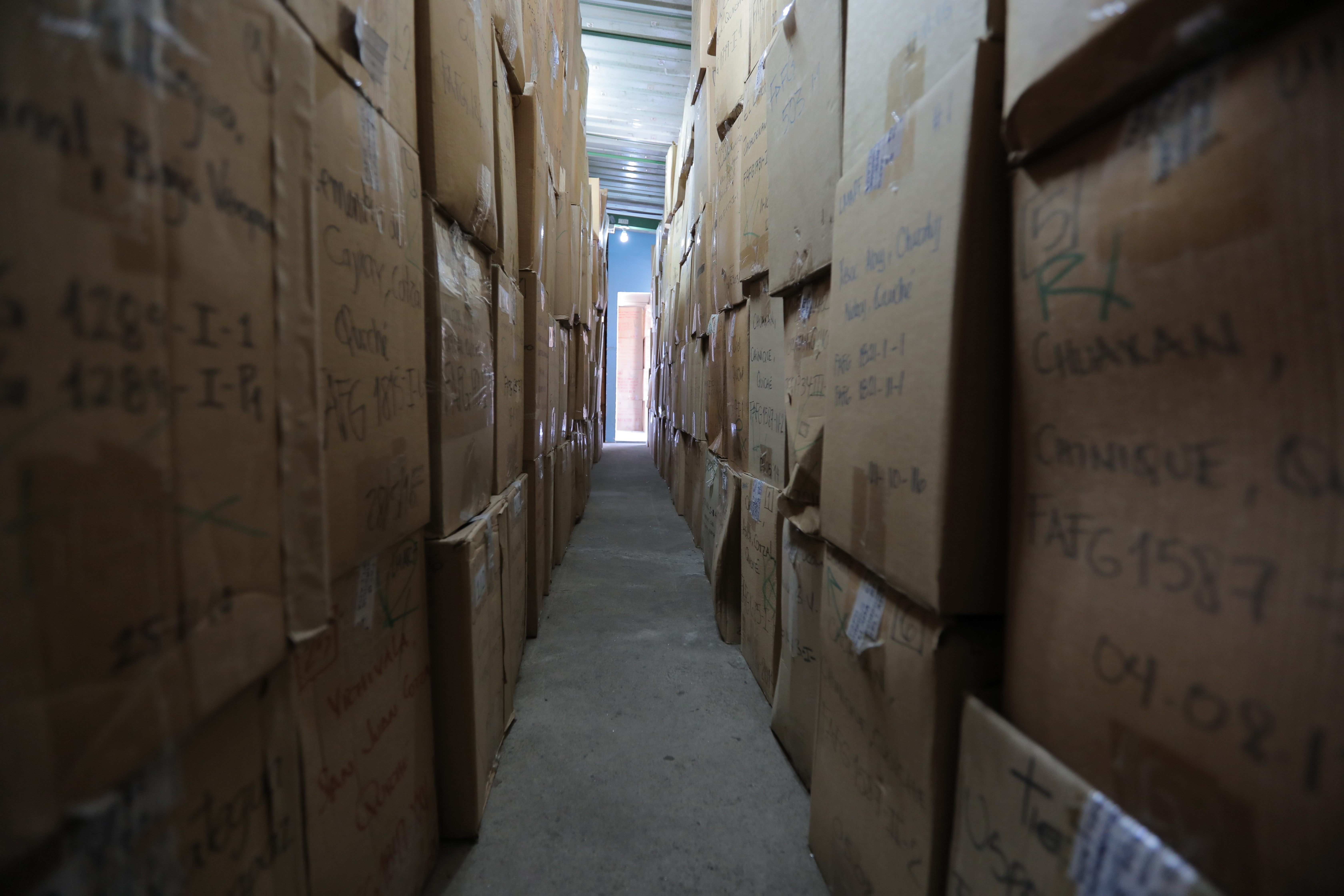 Boxes containing remains from mass graves wait to be identified at FAFG headquarters in central Guatemala City. (Nahlah Ayed/CBC)