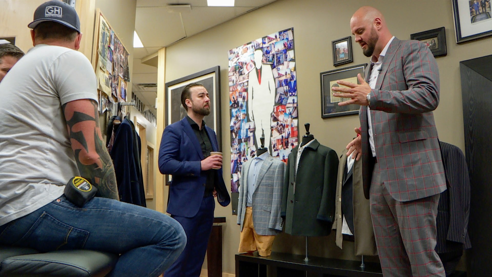 Brad Switzer owns more than a dozen suits, each bearing a unique name stitched inside. (Min Dhariwal/CBC)