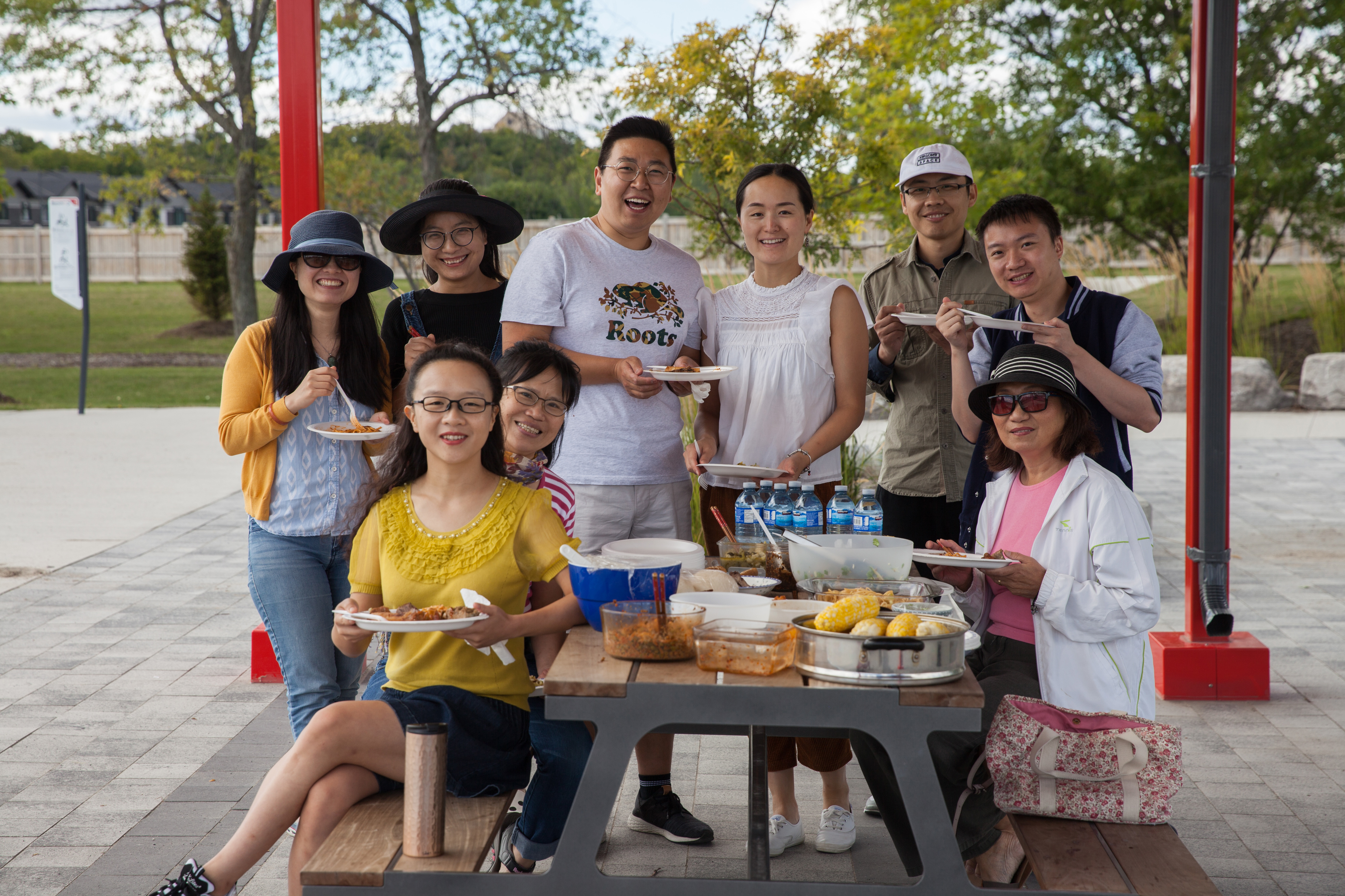Blue Dong (foreground left) and her international book club take their discussion and potluck to the park, come summertime. (Fangliang Xu)