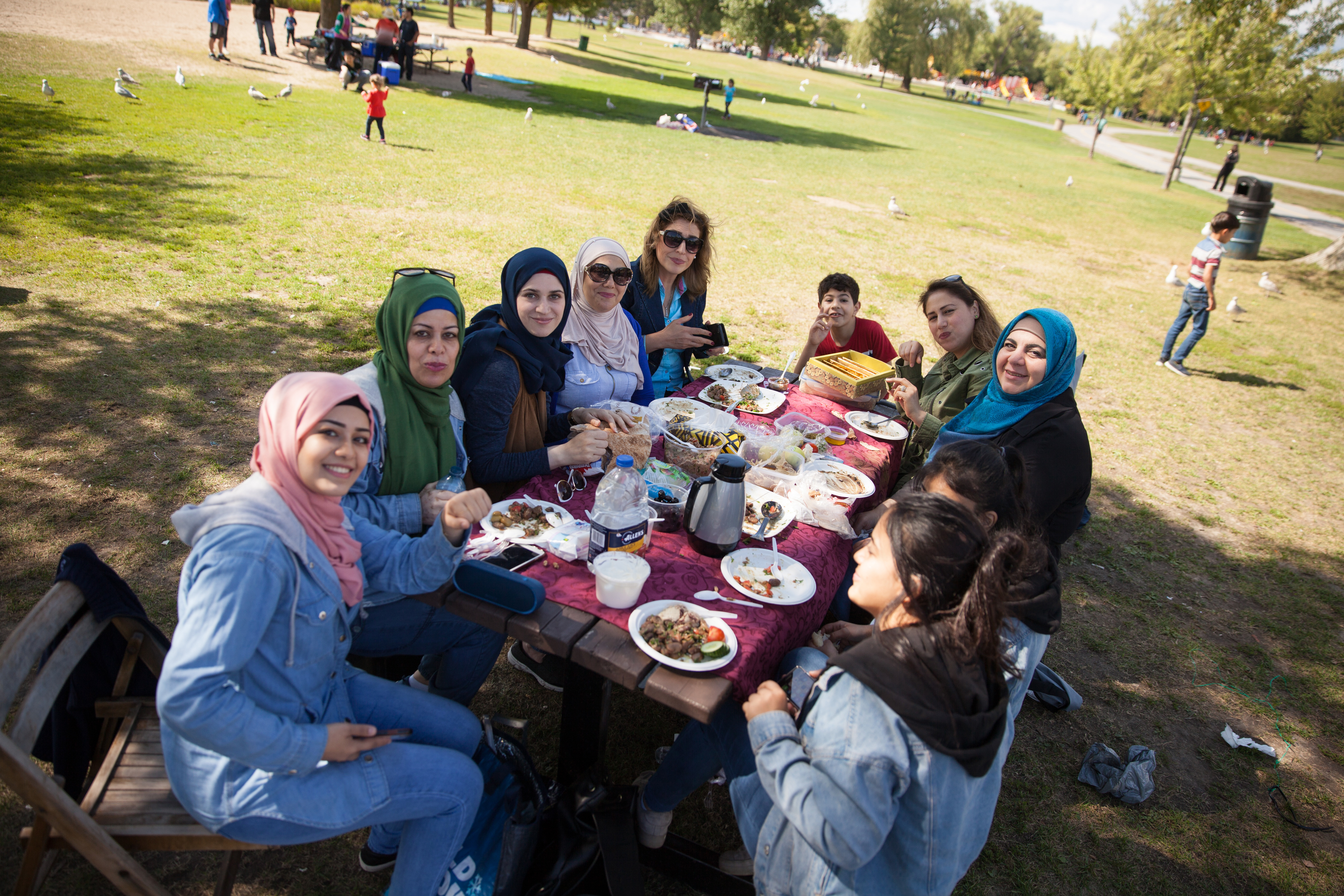 Hiba Haj Moussa (foreground, left) says coming to the park with friends makes her feel less alone. (Fangliang Xu)