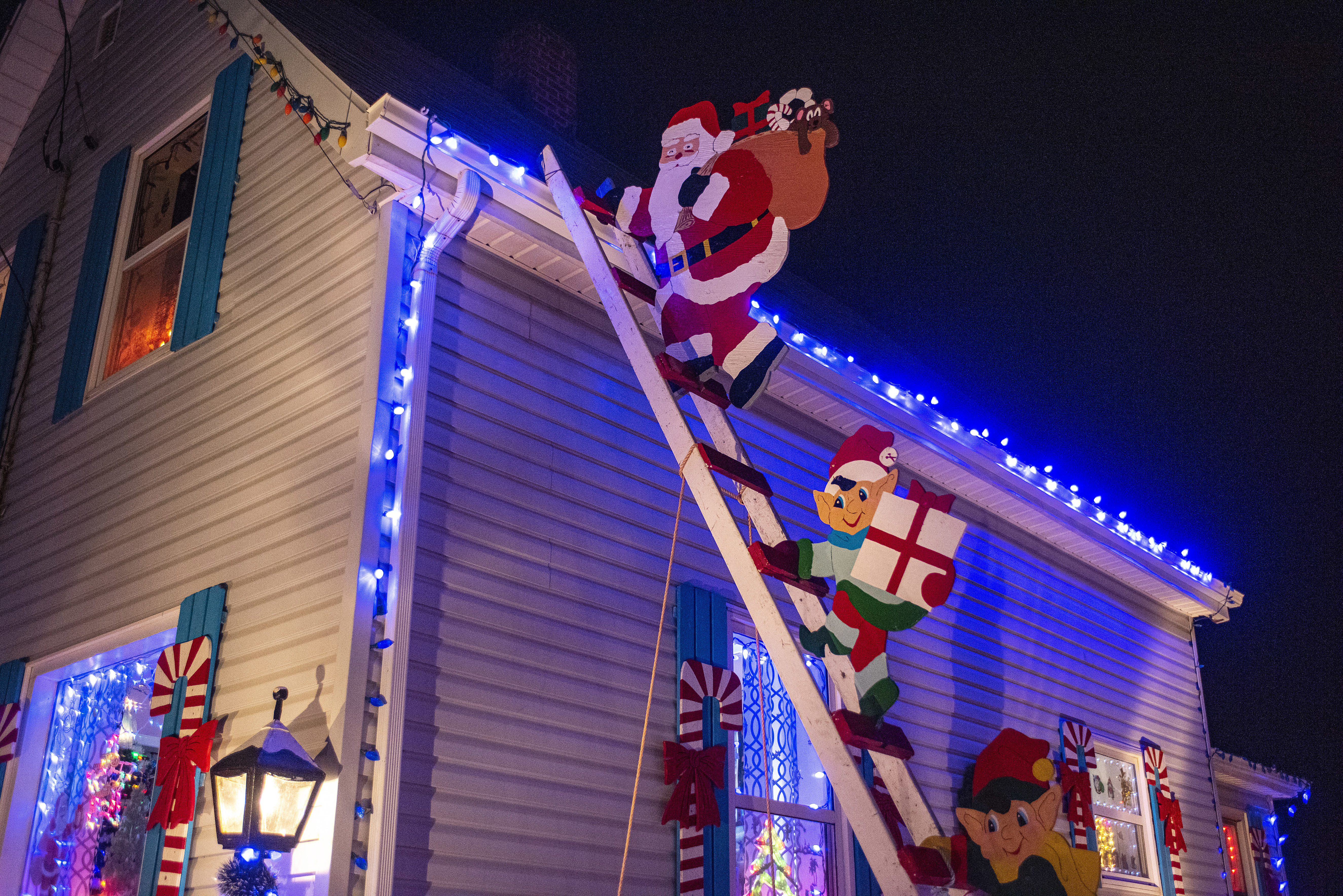 Santa and his elves caught red-handed delivering gifts to a house in North Rustico. (Brian McInnis/CBC)