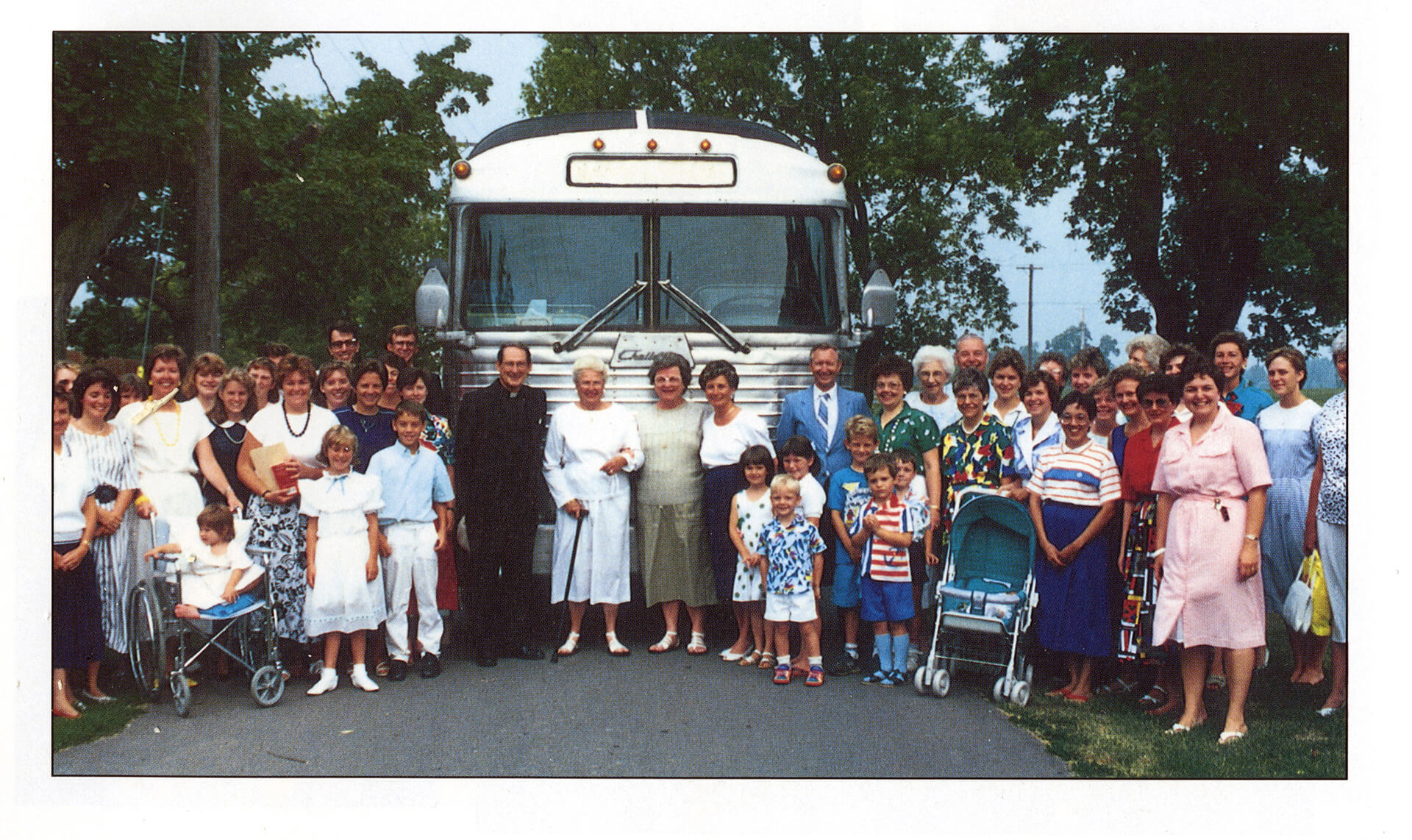 The leaders of the Community of Jesus, Cay Andersen and Judy Sorensen, are seen with Farnsworth, in front of the bus, in 1988 surrounded by Grenville students and staff. Standing to the left of Farnsworth are Michael Phelan and Grace Irving. (Community of Jesus)