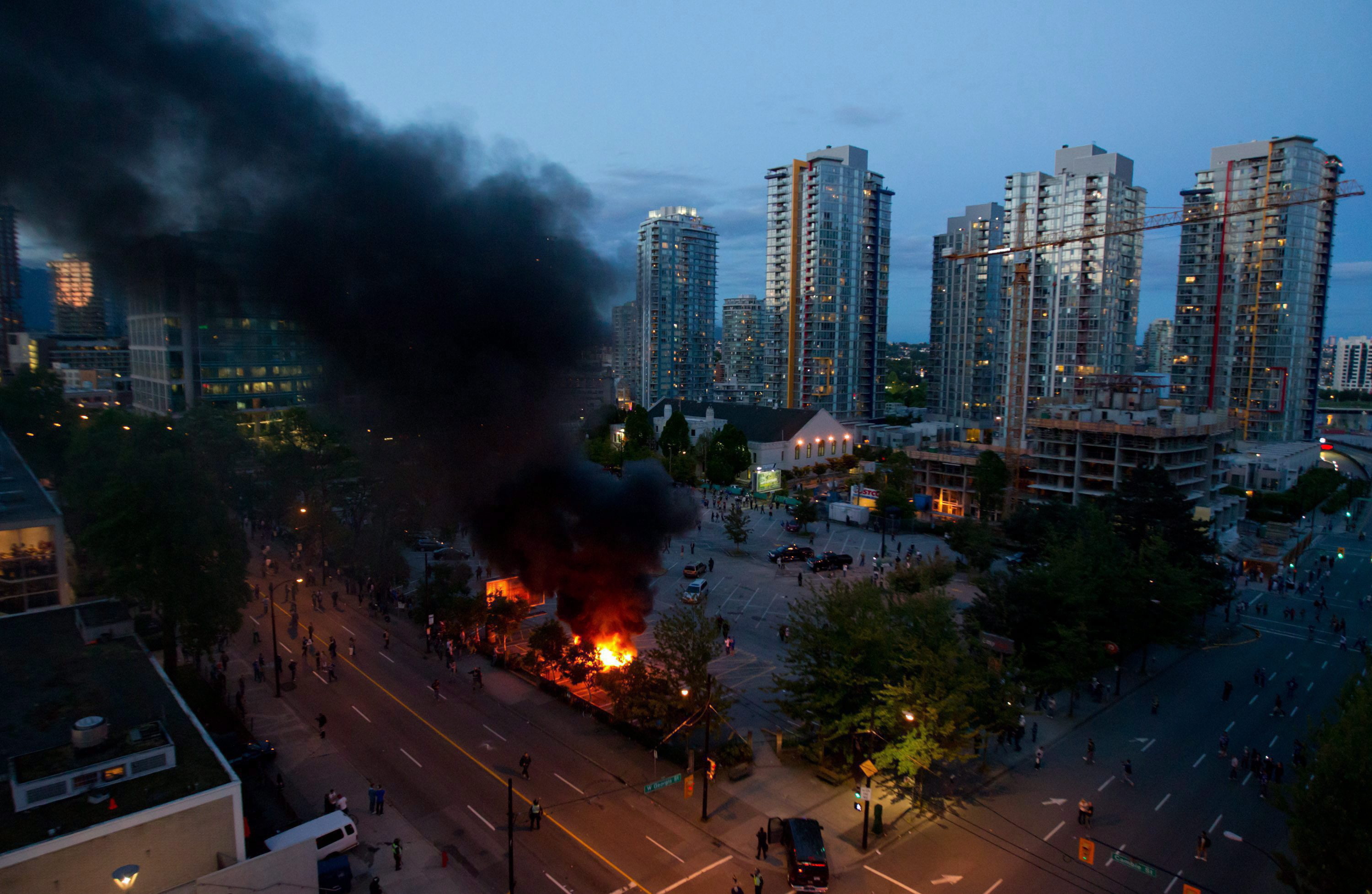 Rioters burn police cars during the 2011 Stanley Cup riot in Vancouver. (Darryl Dyck/The Canadian Press)