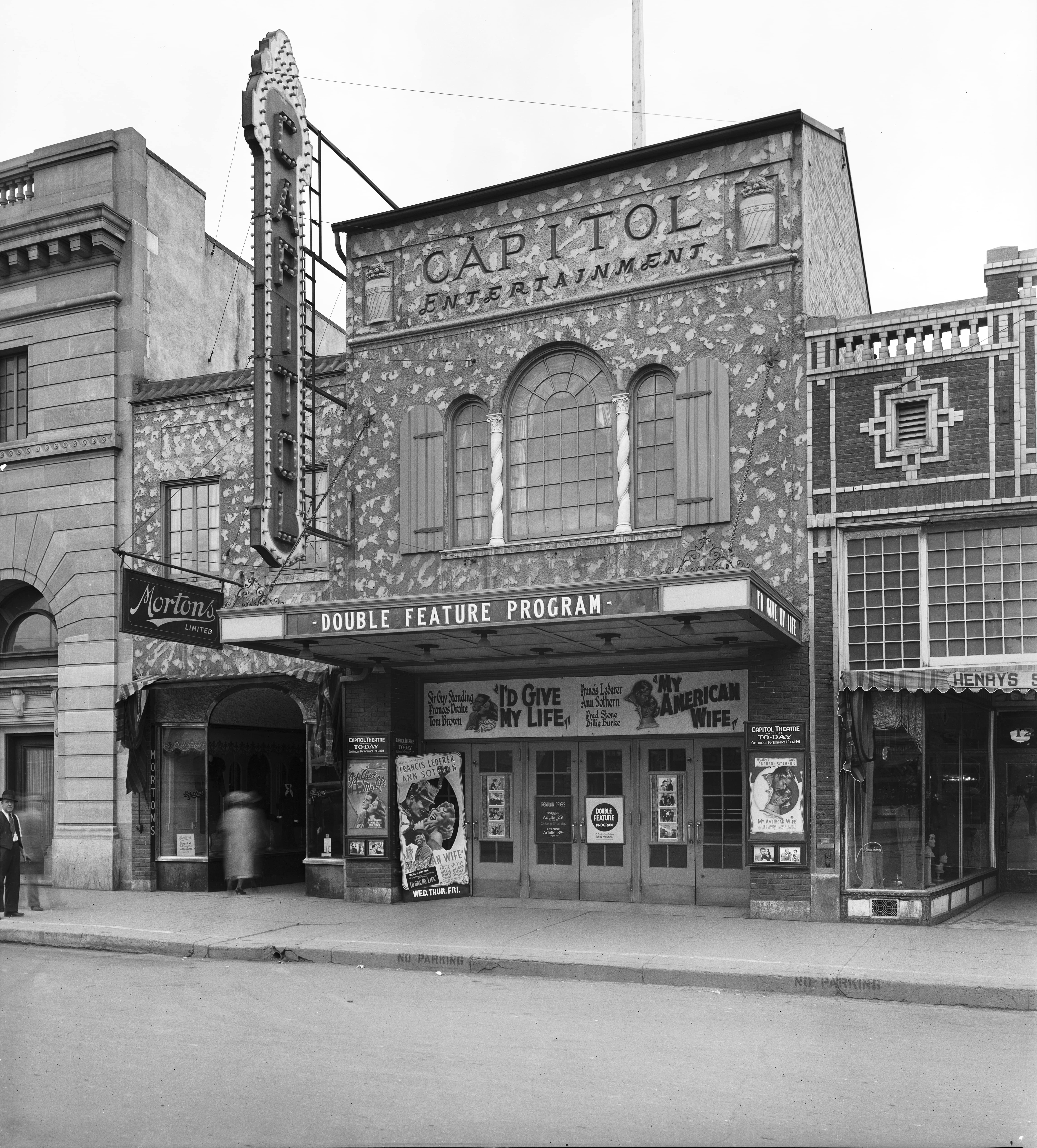 Even Bob Fink, one of the people who would rally to try to save the Capitol in 1979, thought it looked a bit “tacky” from the outside. Look in the bottom right corner of the photo, in the shop window. See the photographer? (Saskatoon Public Library Local History Room; item A-1265)