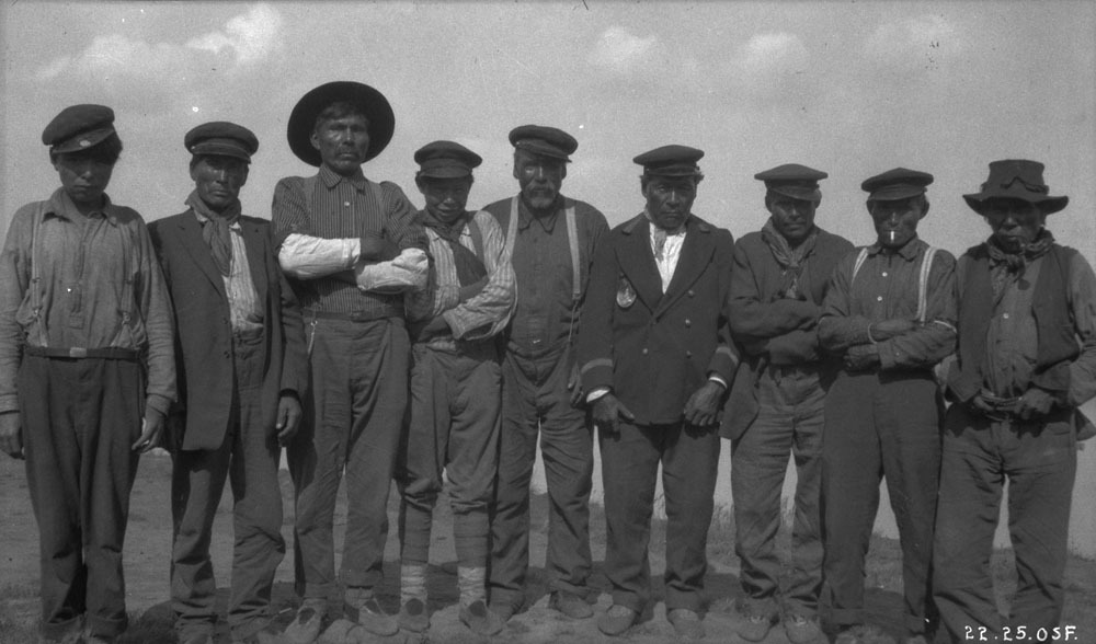 Chief Antoine and other Łı́ı́dlı̨ı̨ Kų́ę́ First Nation Dene men at Fort Simpson in 1921. Conroy had told his superiors the Dene were eager to make a treaty, but the reality was that his treaty was met with deep skepticism across the North. (Oswald S. Finnie / Canada. Dept. of Indian and Northern Affairs / Library and Archives Canada / PA-100350)