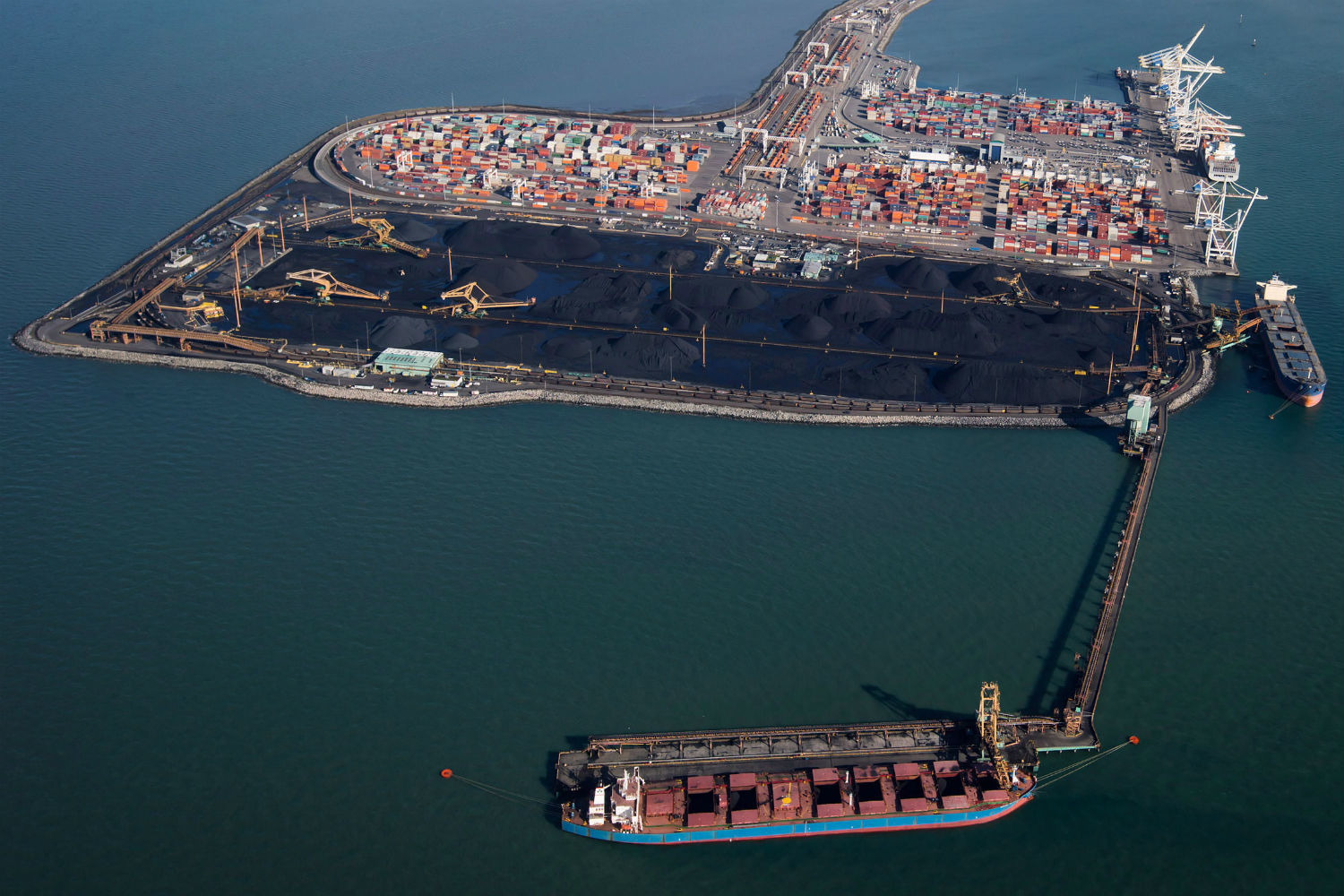 Ships are loaded with coal at Westshore Terminals in Delta, B.C., in this file photo from Feb. 19, 2014, as seen from a National Aerial Surveillance Program flight. (Darryl Dyck/Canadian Press)