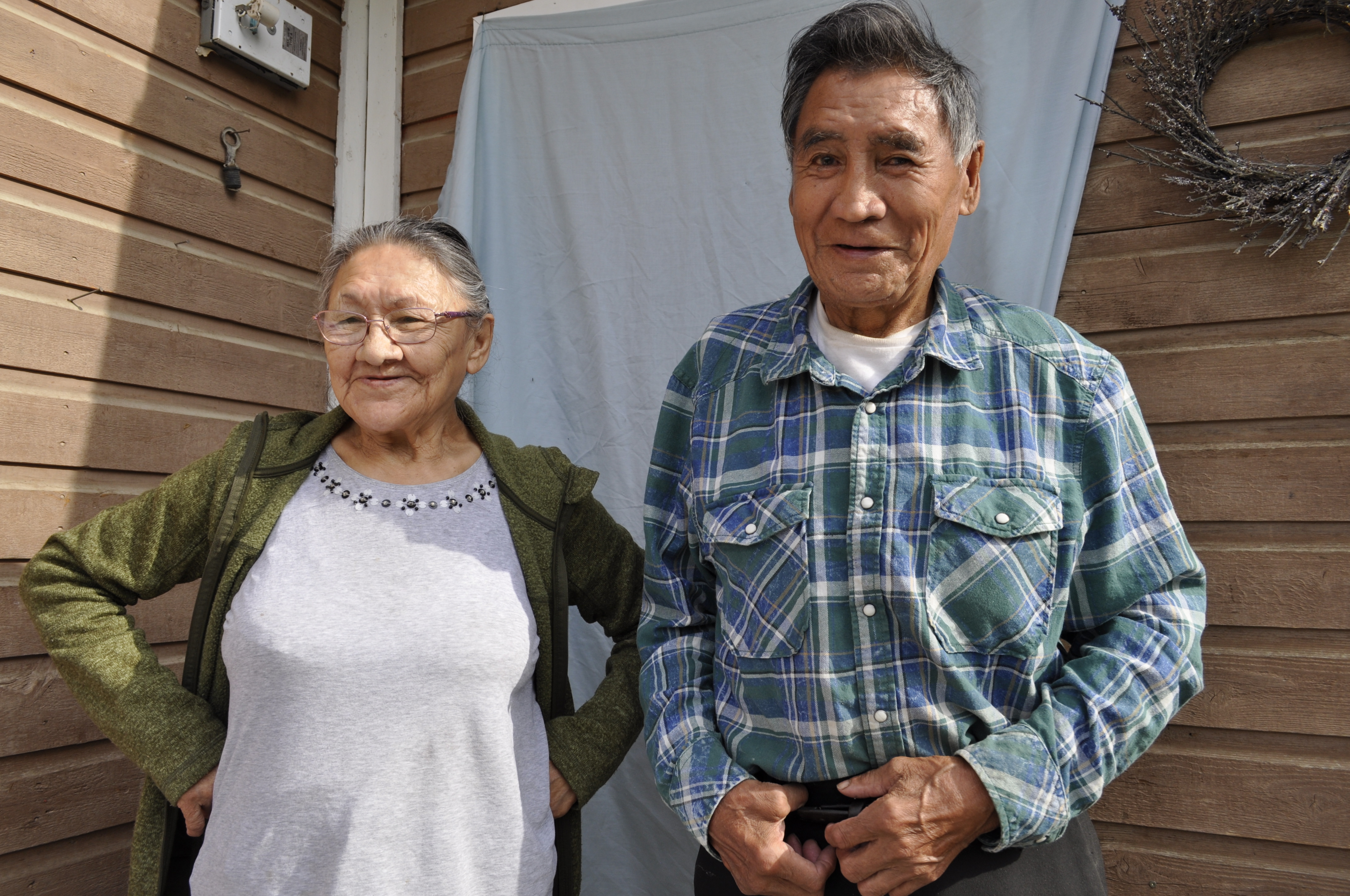 Margaret and Edward Kelly have lived in their home in Fort Good Hope, N.W.T., for 30 years. It's falling apart, and they blame the permafrost shifting beneath their feet. (Alex Brockman/CBC)