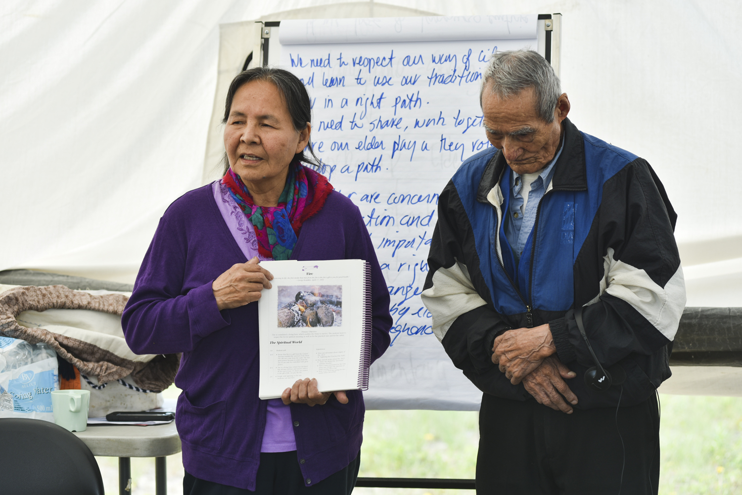 Rosa Mantla and Phillip Dryneck present the Dene Kede at the workshop. (Walter Strong/CBC)