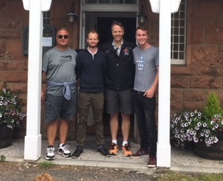 David Brand, second from left, and Nick Brand, right, took a photo with Lt.-Gen. Al Meinzinger, second from right, outside the Brands' Blackwaterfoot Lodge after an unlikely meeting. (Submitted by David Brand)