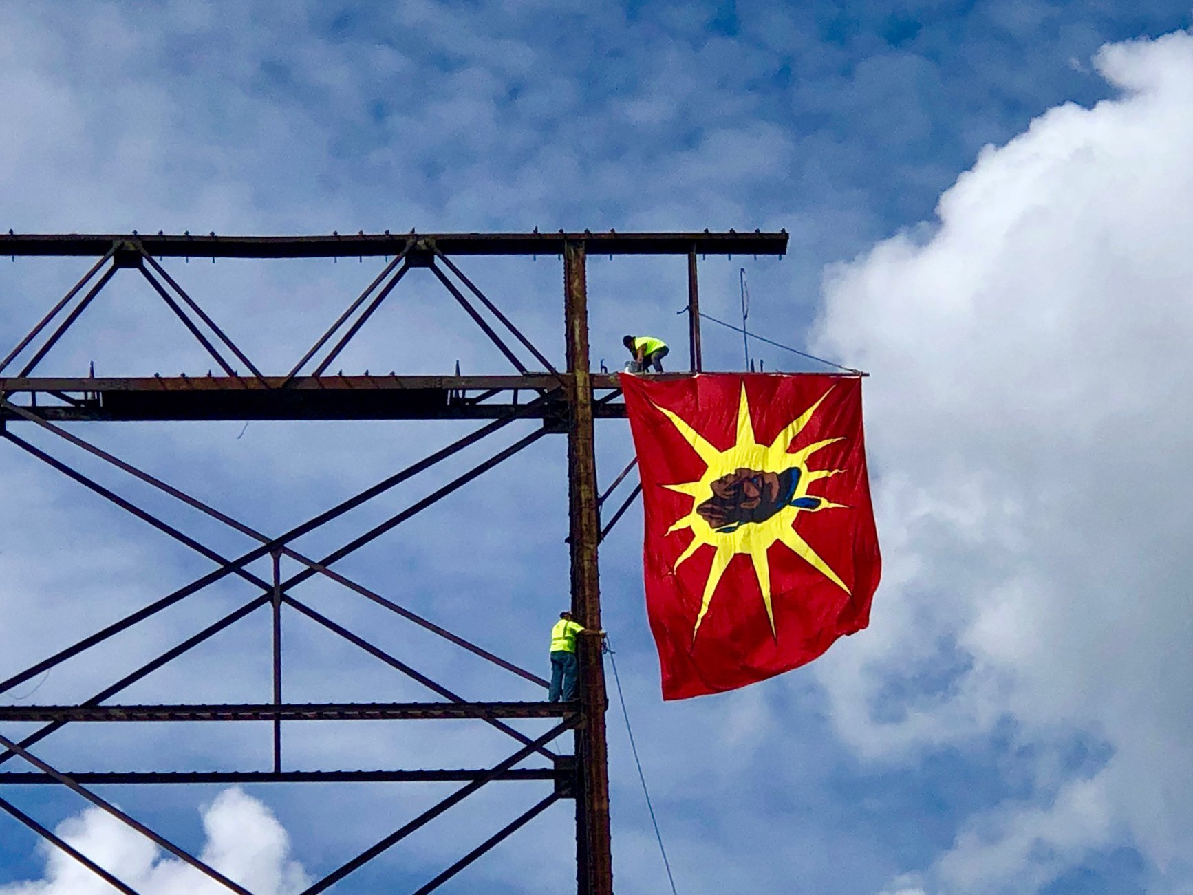 In 2019, several large-scale flags were hung off the Honoré Mercier Bridge in Kahnawake, Que., to commemorate the 29th anniversary of the Oka Crisis. (Submitted by Deidre Diome)