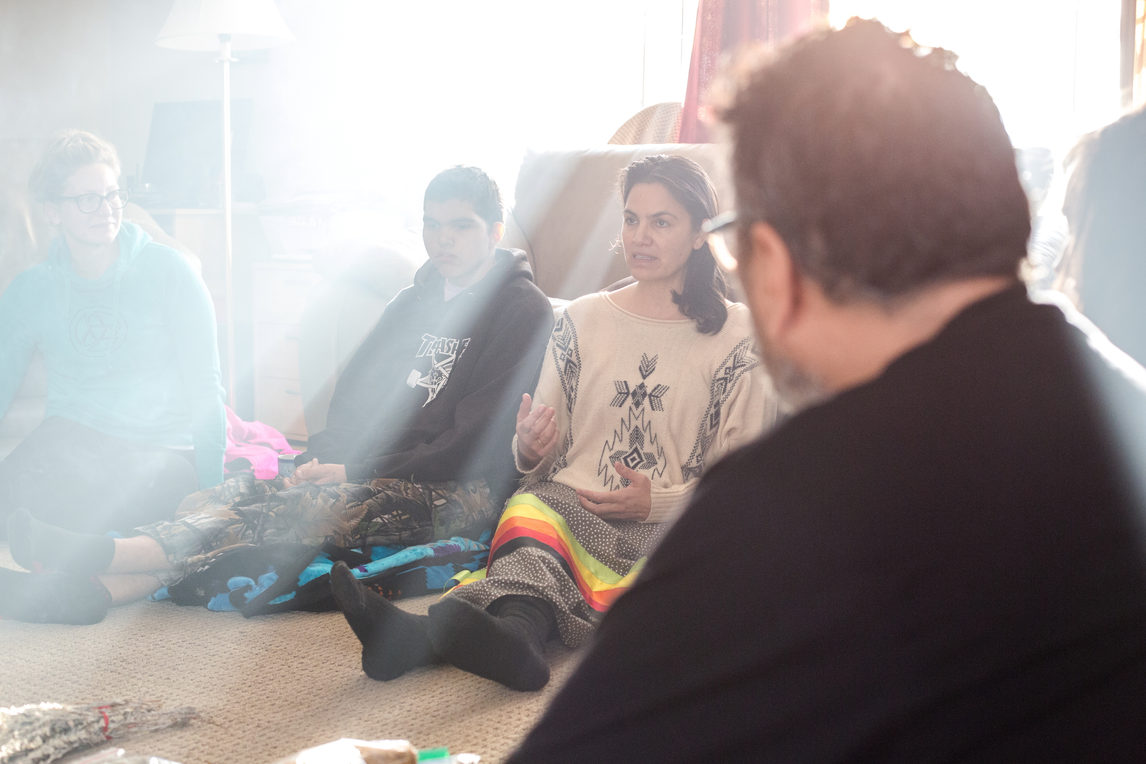 Emery, his mother Lana Whiskeyjack and father James Knibb-Lamouche take part in a traditional Cree ceremony called 'Rites of Passage.' (Rebecca Lippiatt)